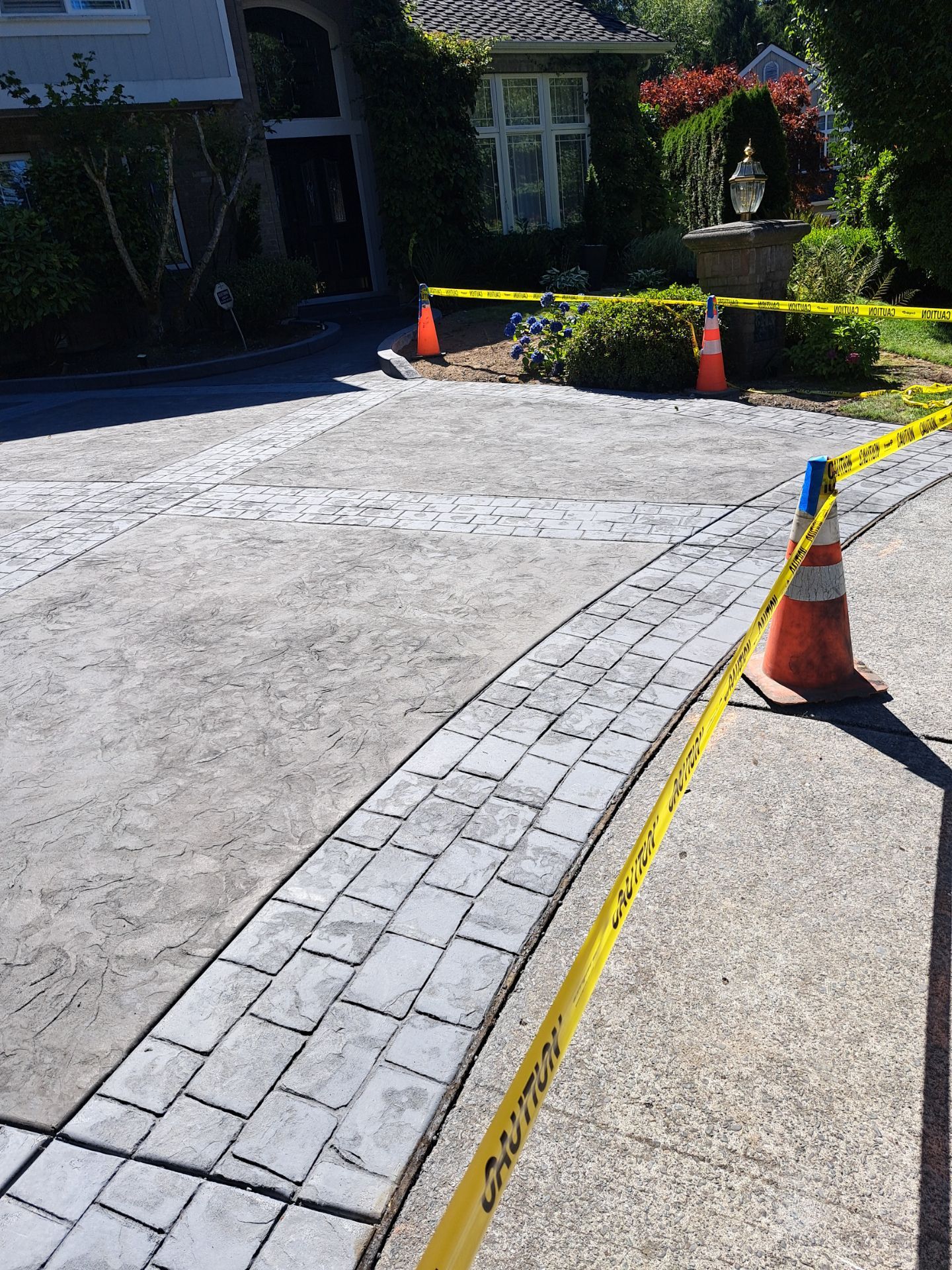 Multi-color Stamped & Sealed Concrete Driveway Renovation | Mukilteo by Jireh Asphalt & Concrete Inc