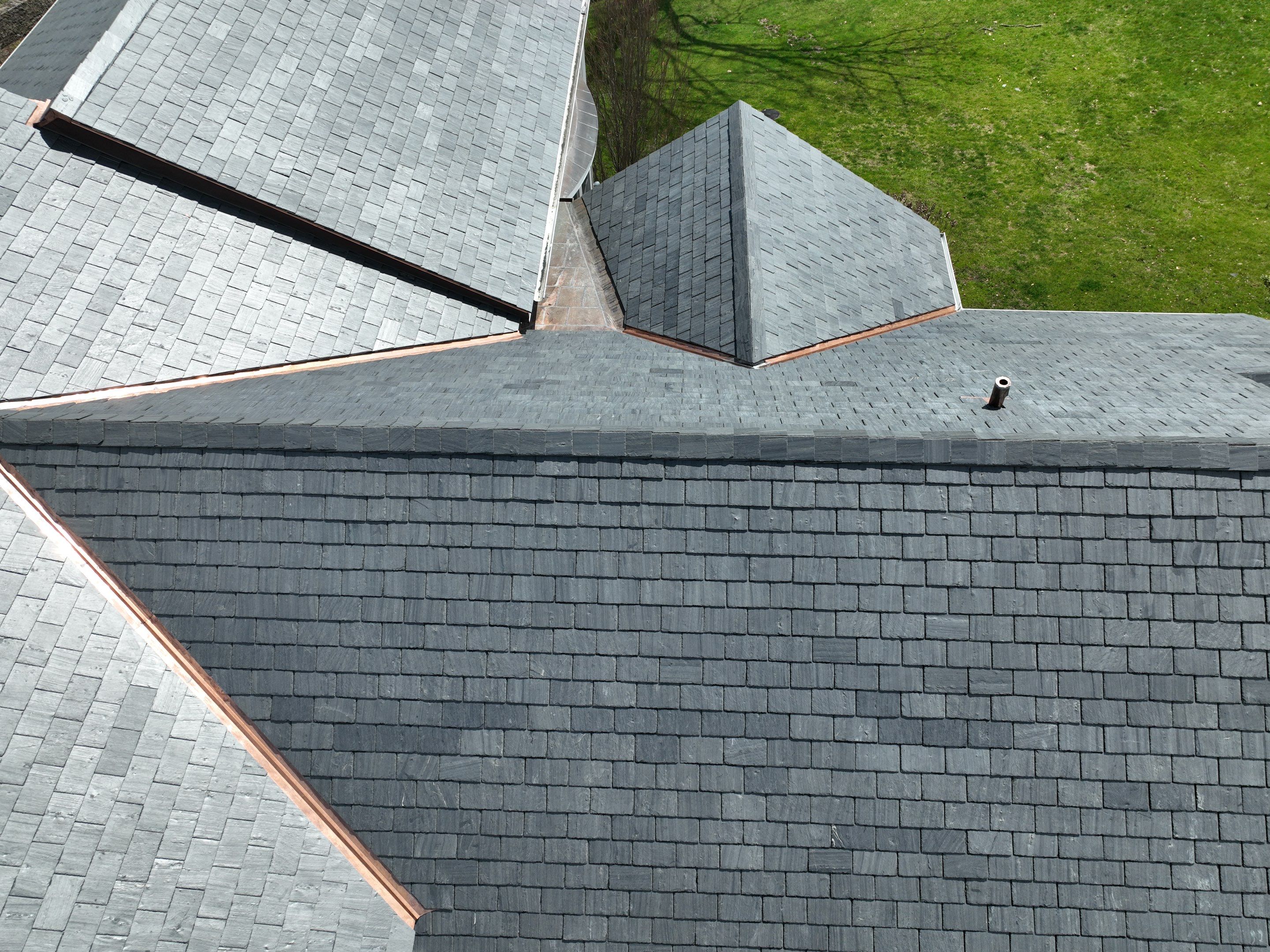 Residential Roofing Installation using Vermont Slate by A Plus Exterior