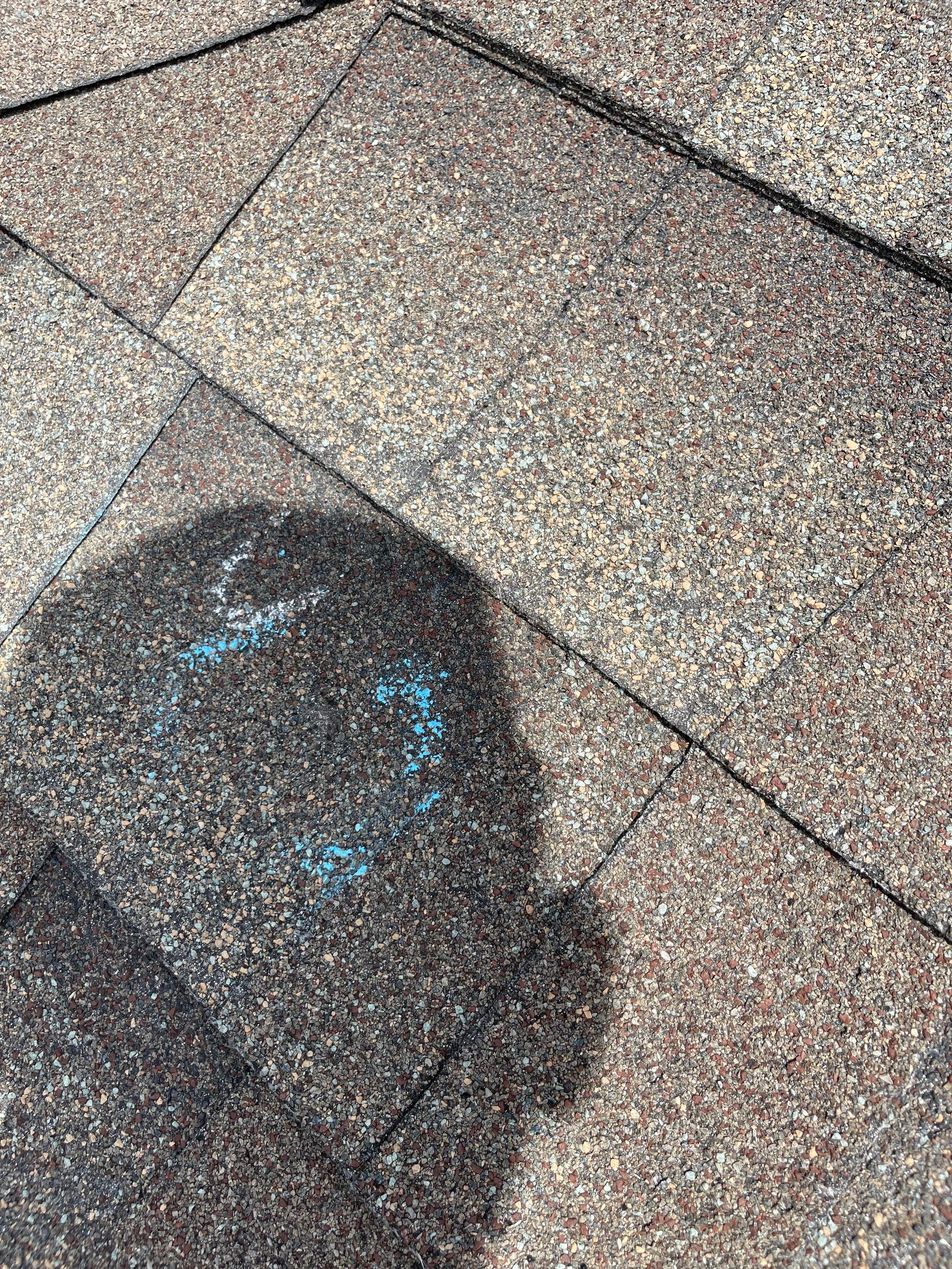 Hail Damage on a Roofing System by Icon Roofing And Construction 