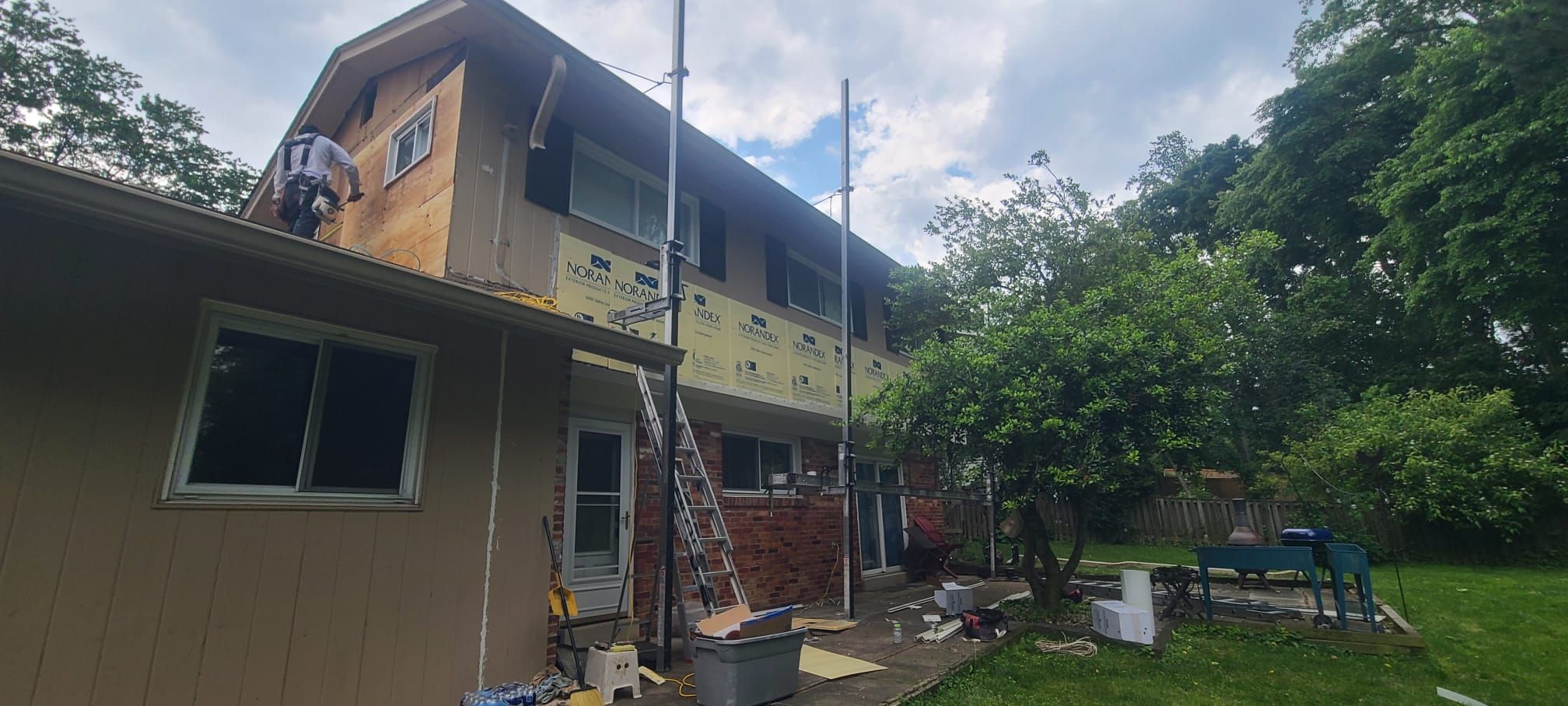 Fairfax: Residential Siding Replacement with CertainTeed 8" Board and Batten Siding in Desert Tan by RM Banning, Inc.