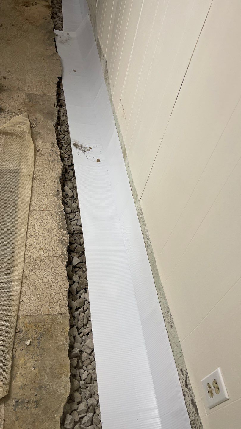Interior Waterproofing Using GrateDrain™ Products by Toledo Basement Repair