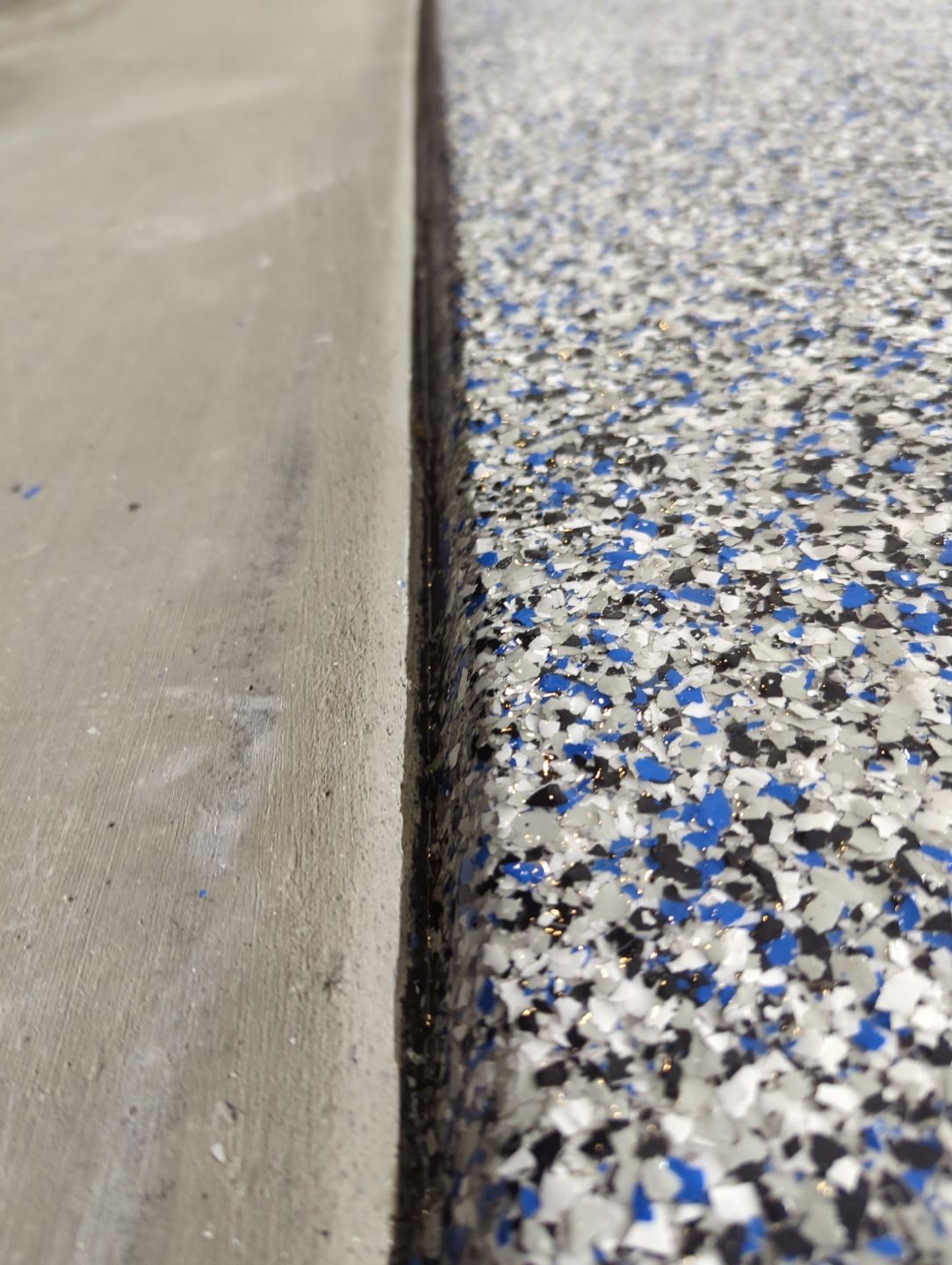 Garage Transformation using Domino with Blue by Croc Coatings, LLC