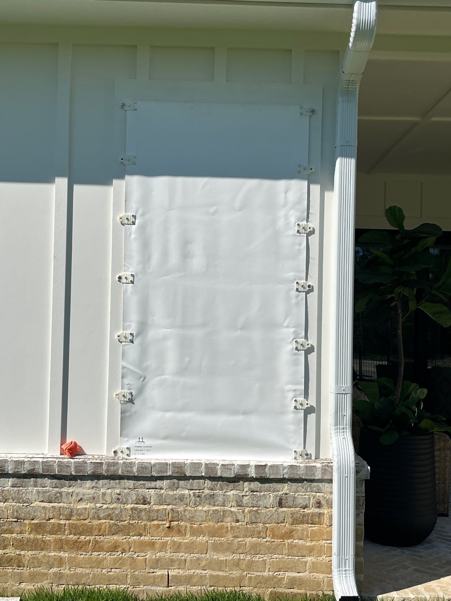 Custom Hurricane Fabric Storm Shutter Installation in Panama City by Brannan Aluminum Inc.
