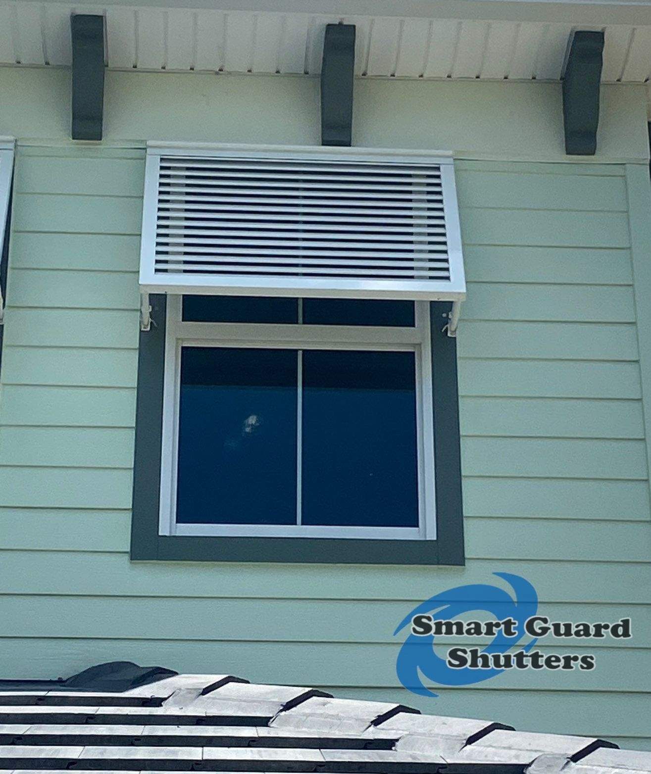 Decorative Bahama Shutters in Traffic White by Smart Guard Shutters