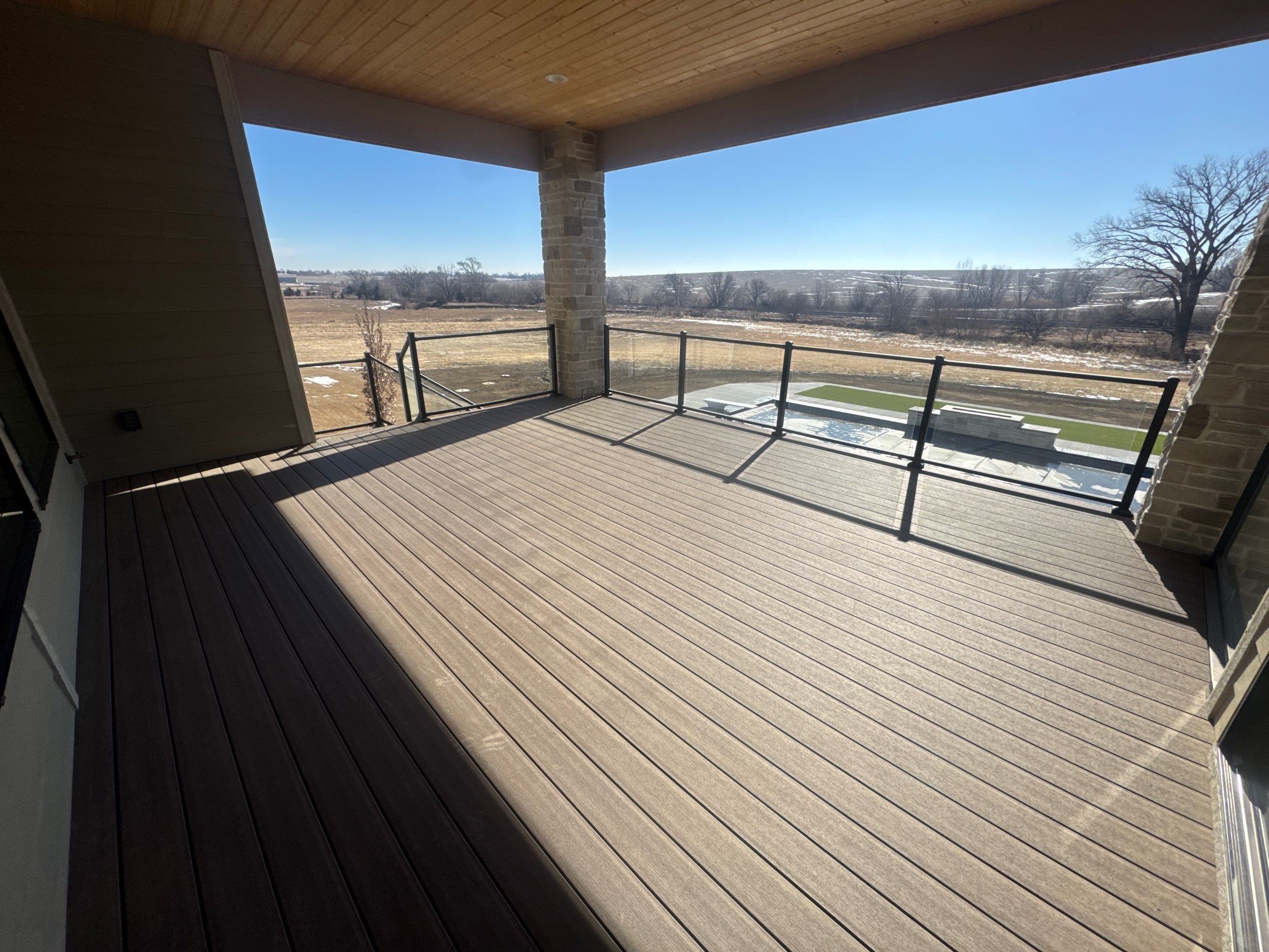 Timbertech Deck with Glass Railing by EAGLE EYE ENTERPRISES