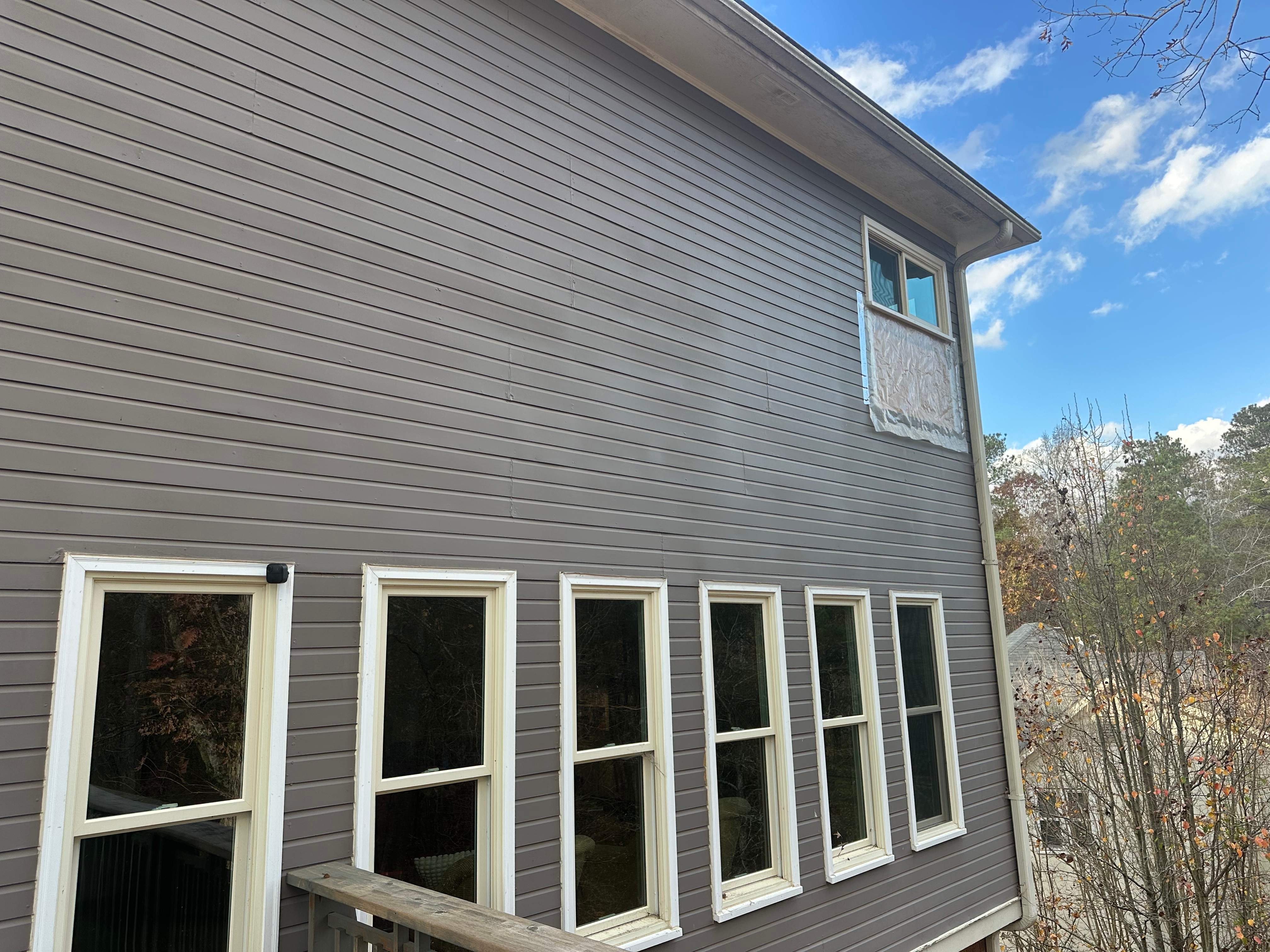 James Hardie Siding Replacement, Exterior Painting, Deck Stain, and Gutter Installation in Peachtree Corners, GA by Nelson Exteriors