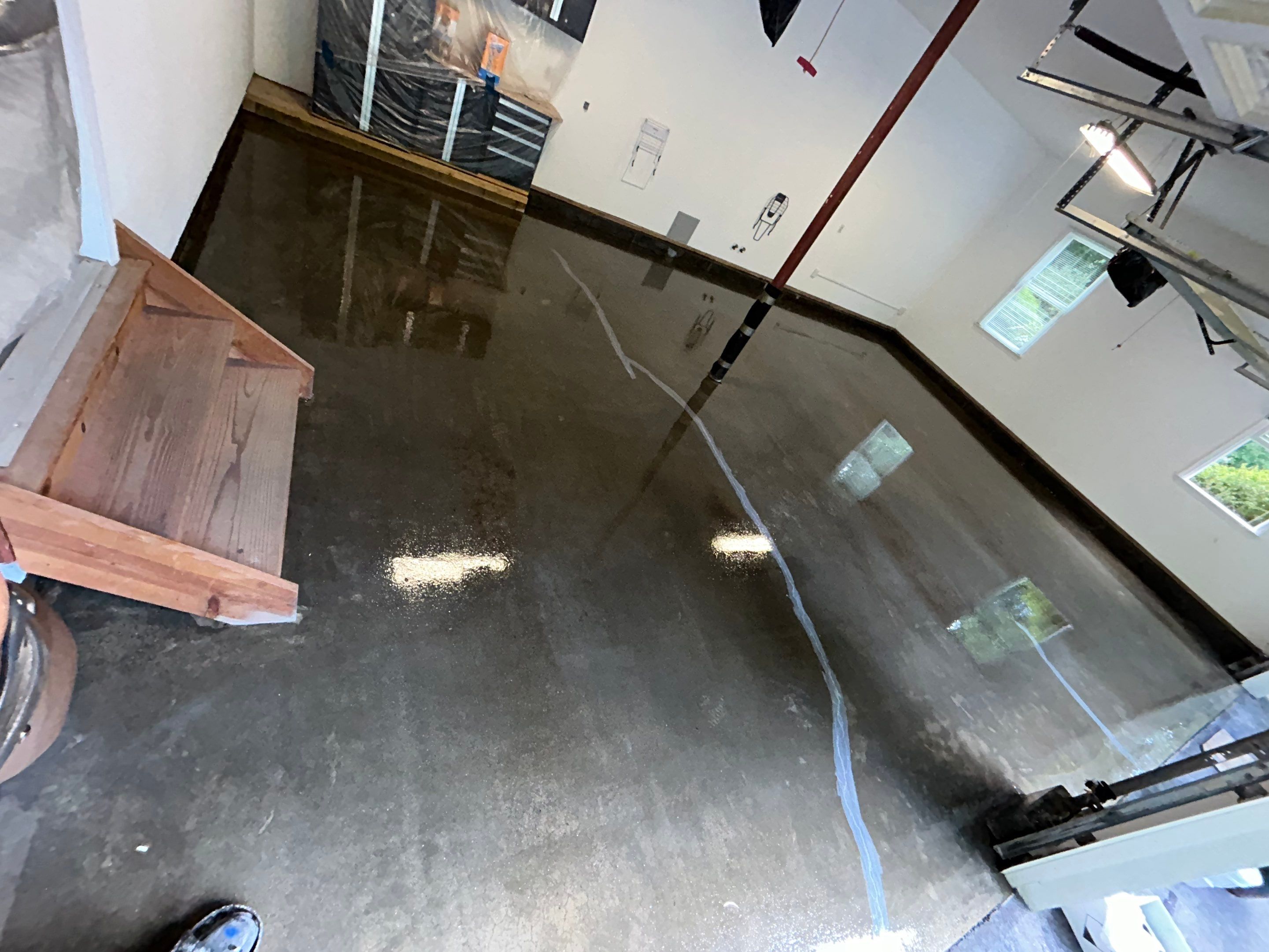 Wombat Concrete Floor Coating Transformation by DiGiorgi Roofing and Siding Inc