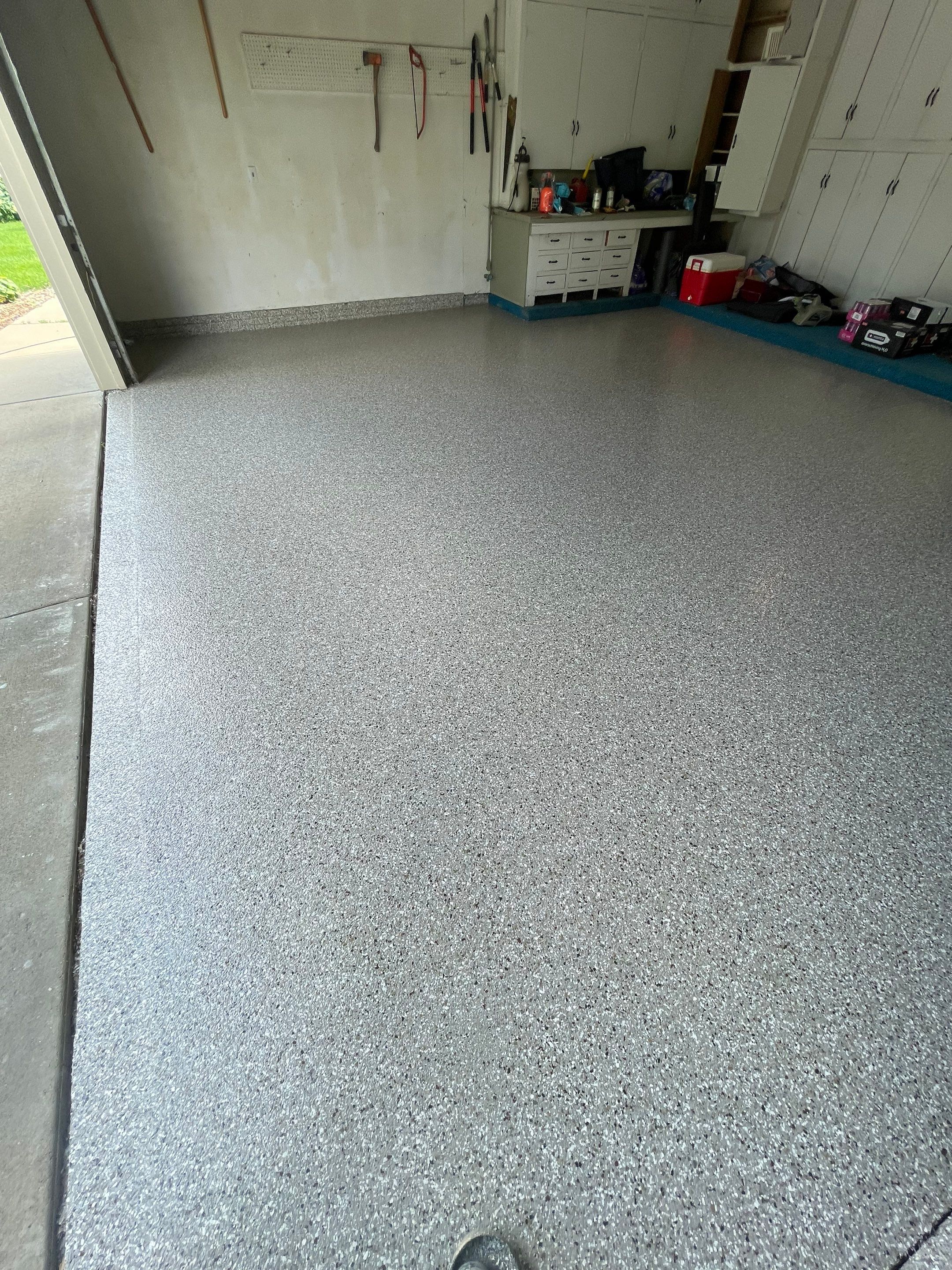 Custom Creekbed Garage Floor Coating in Sioux Falls by Select Painting, Coatings & Garage Cabinets