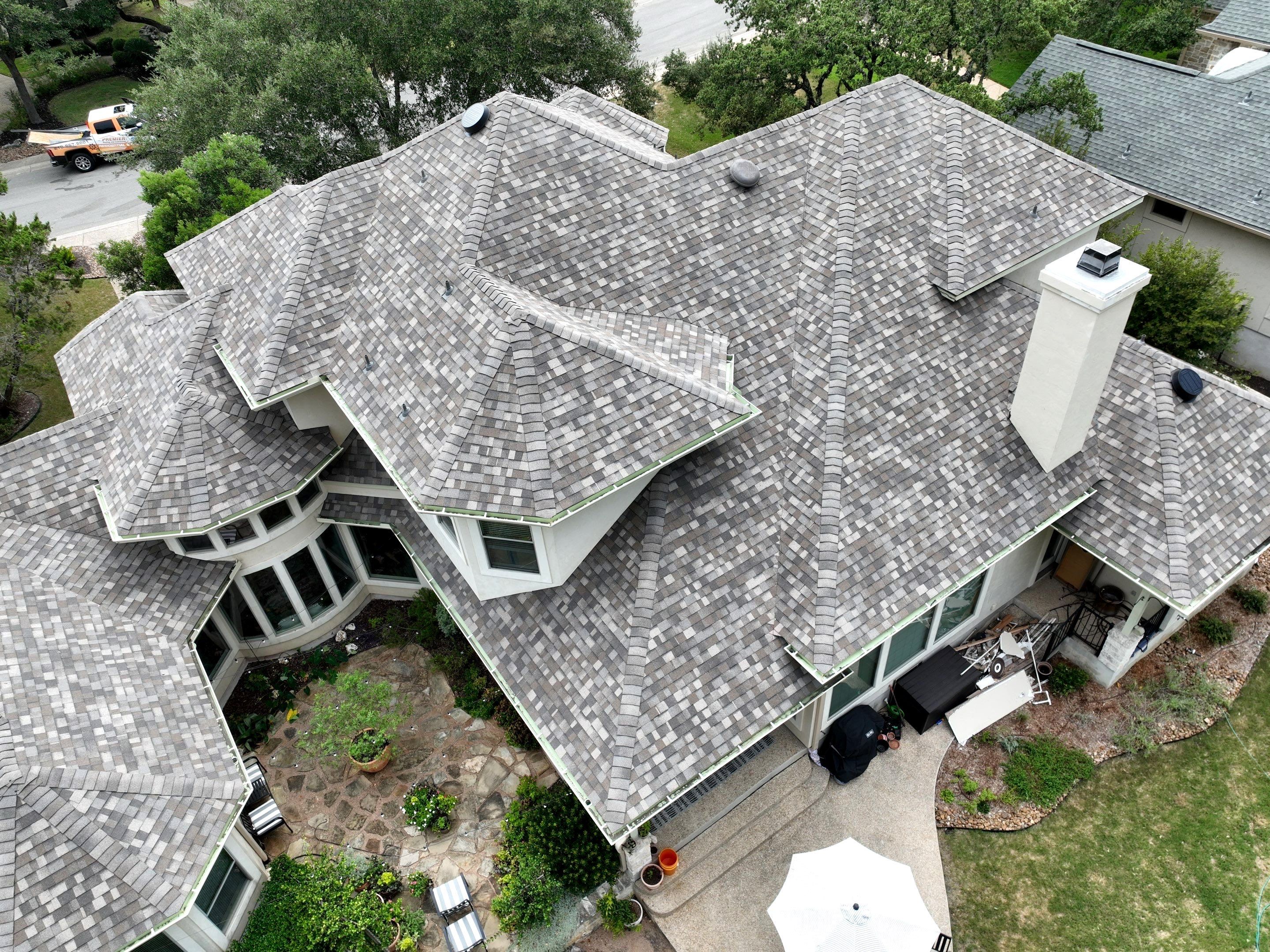 Residential Roof Replacement using 30 Year Laminate Shingles with High Profile Ridge by Premier Roofing and Contracting