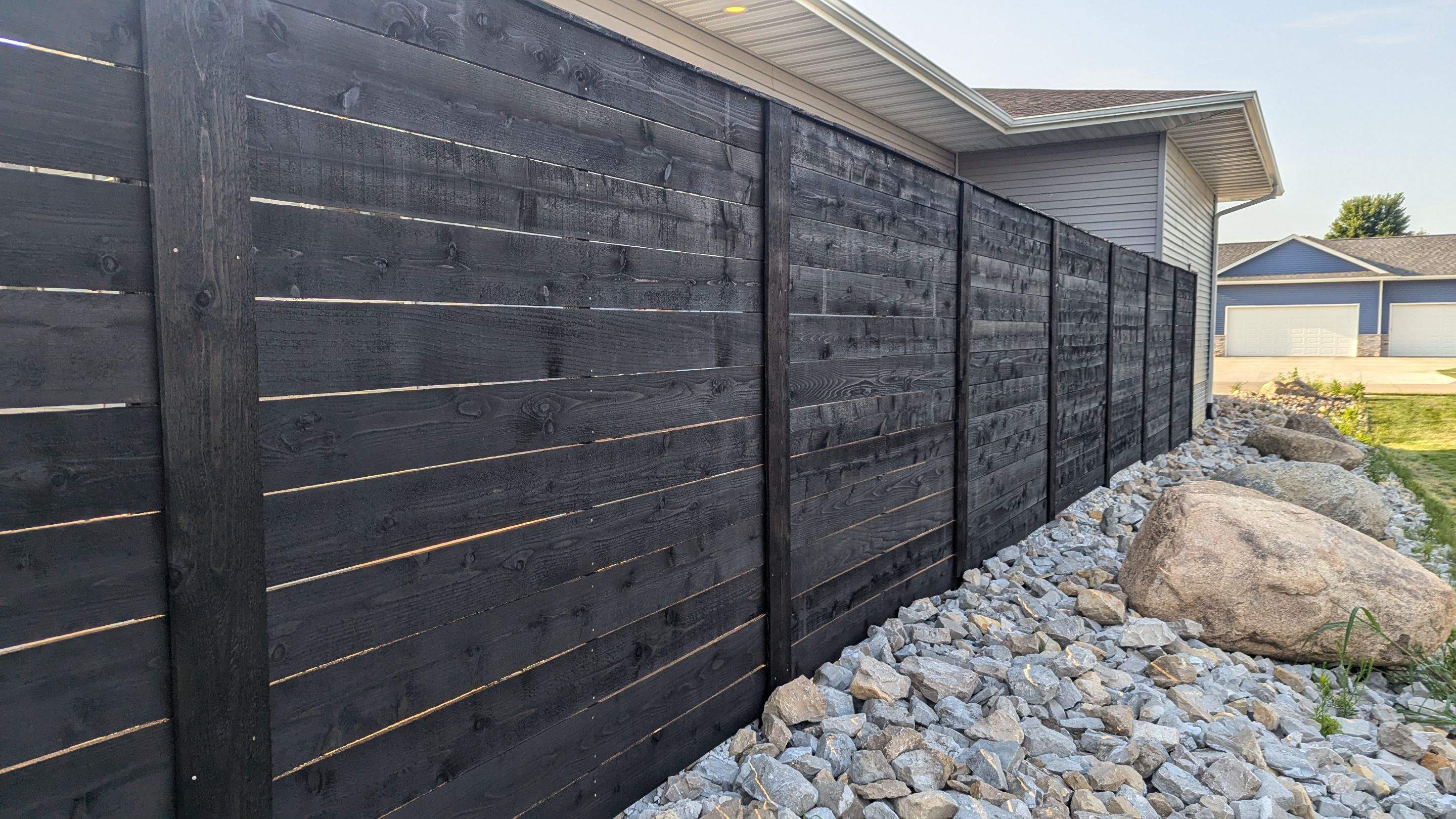 Modern Black Stained Horizontal Privacy Fence Installation in Cedar by Perfect Picket Fence and Stain