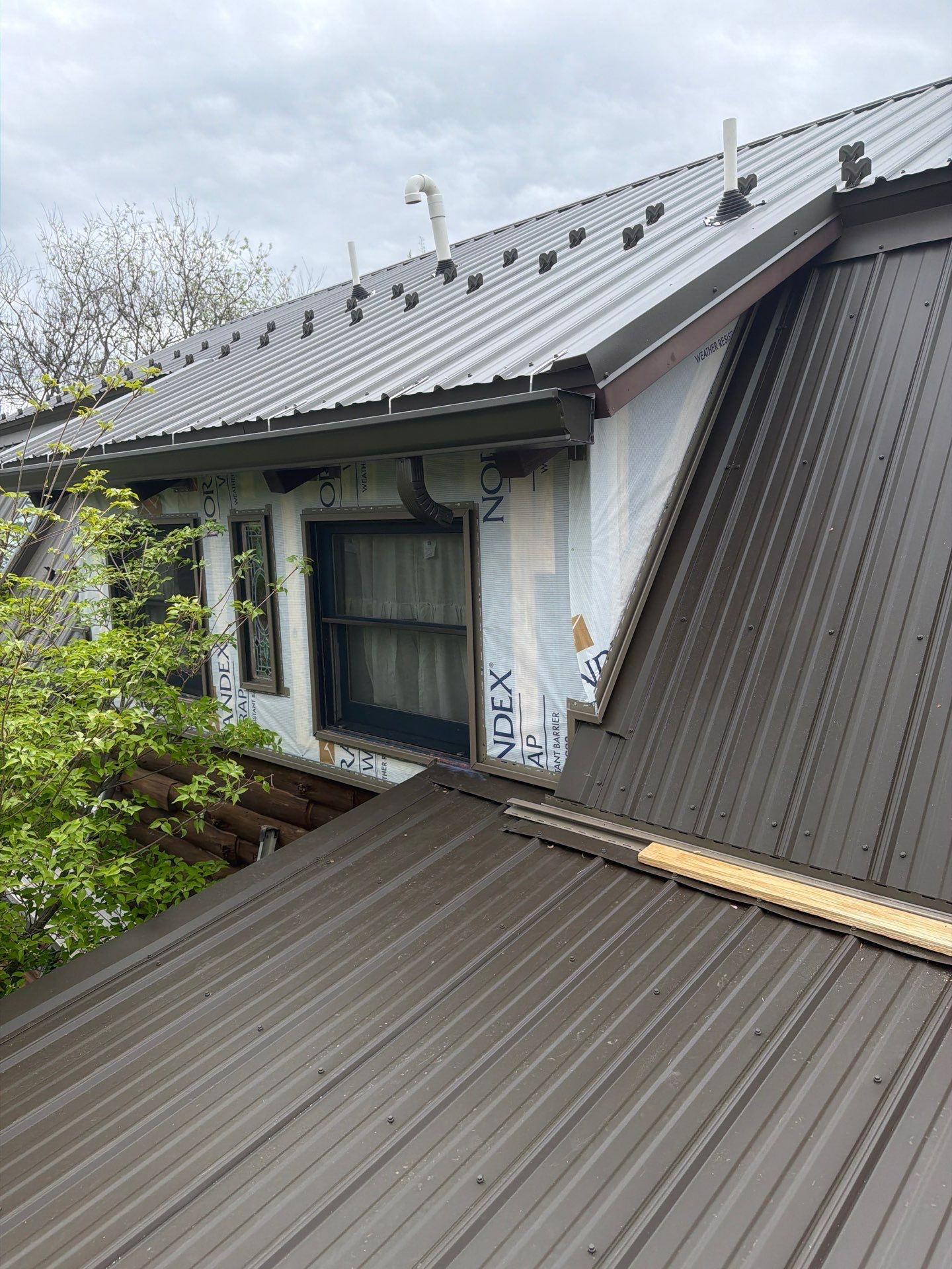 Textured Bronze ABM Metal Roof and Skylight Installation in Halifax by Esh Builders
