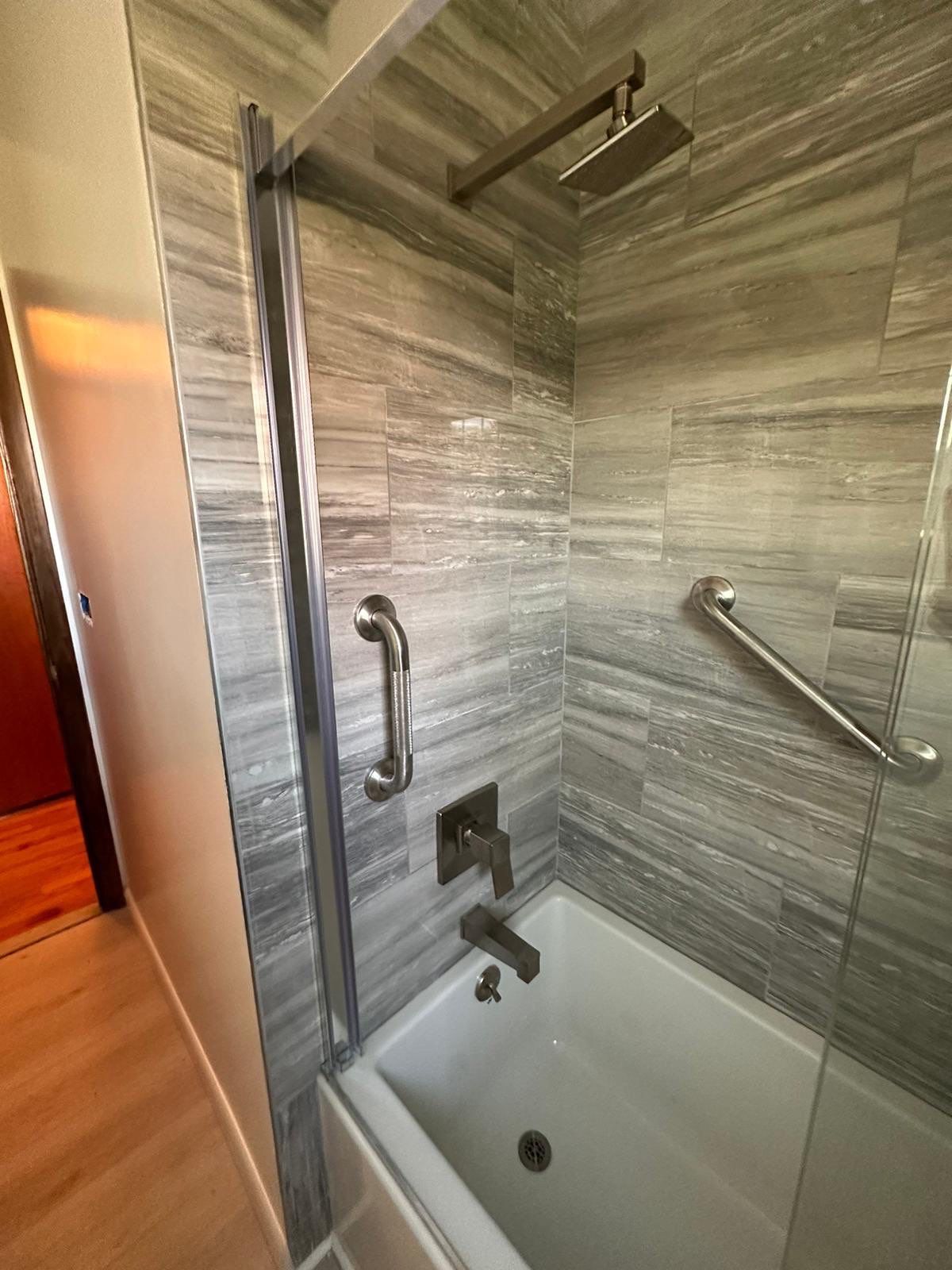 Bathroom Remodel using Tile by Home Concepts Construction