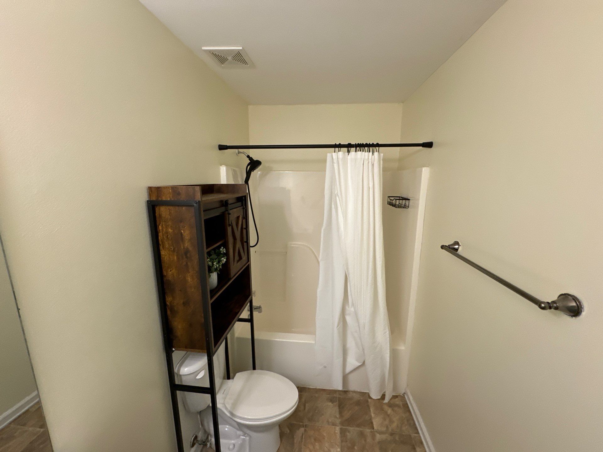 Tub to a curbless walk-in shower by Prudencio