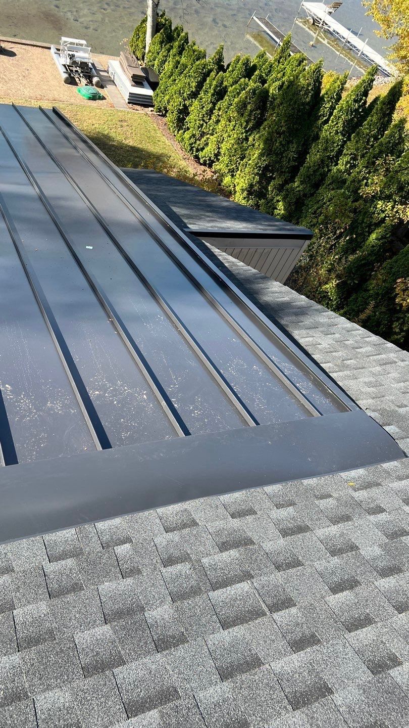New Shingle Roof with Metal roof accents by Bloomfield Construction & Restoration