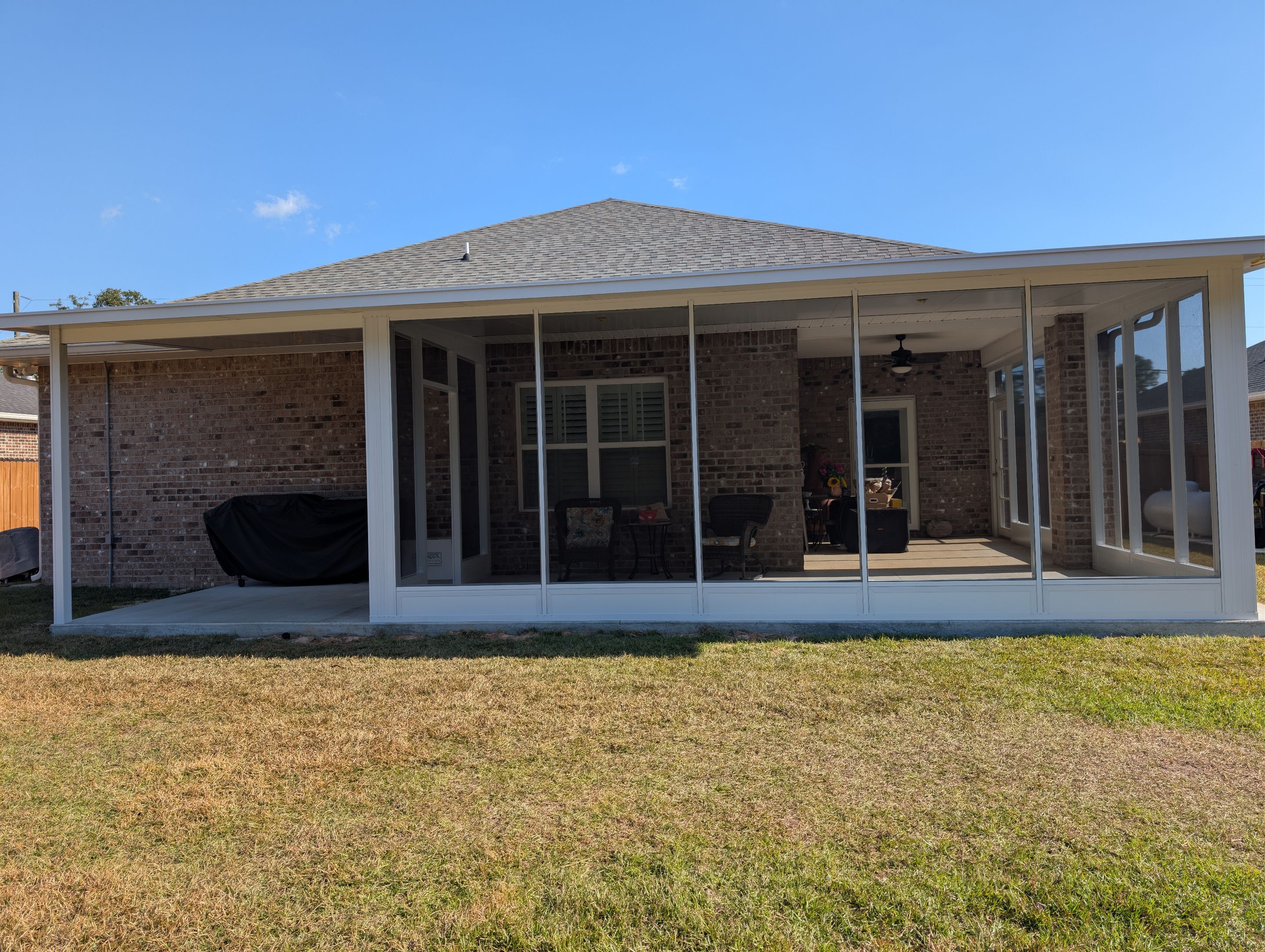 Home addition w/Vinyl 4-Track Windows by Titan Sunrooms