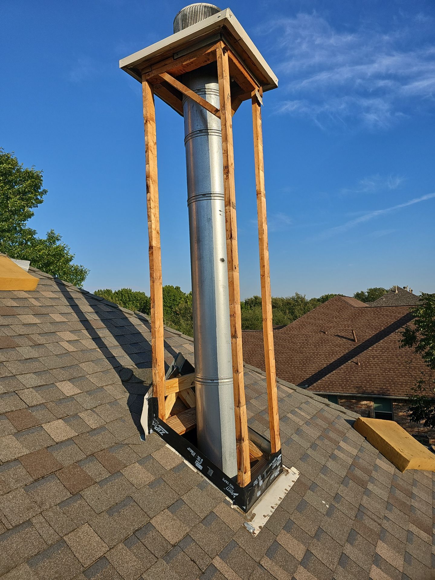 chimney repair using lap engineered treated composite siding. by road roofing llc