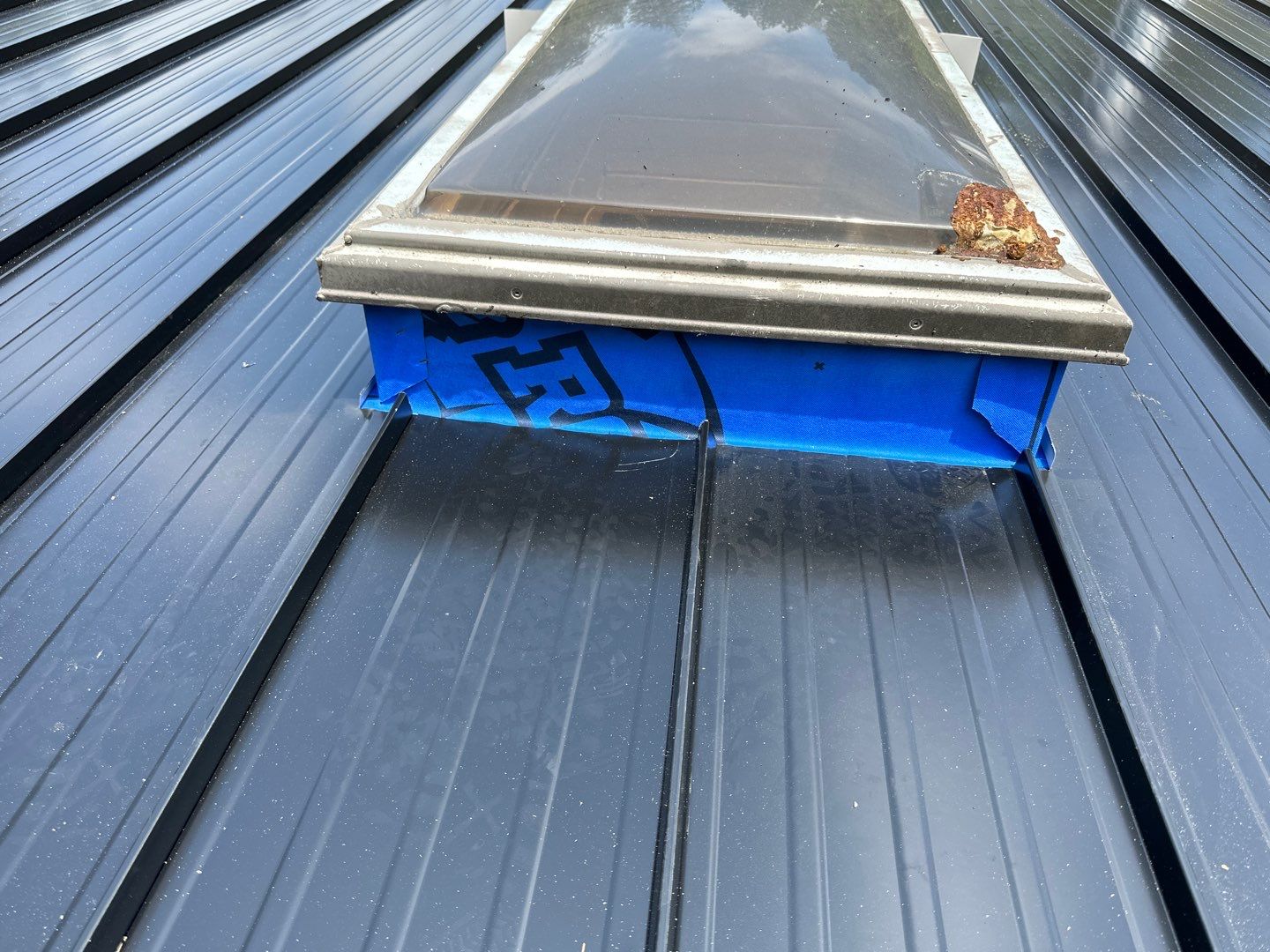 Residential ReRoofing Installation using 12" Prolok metal by Top Notch Roofing Inc