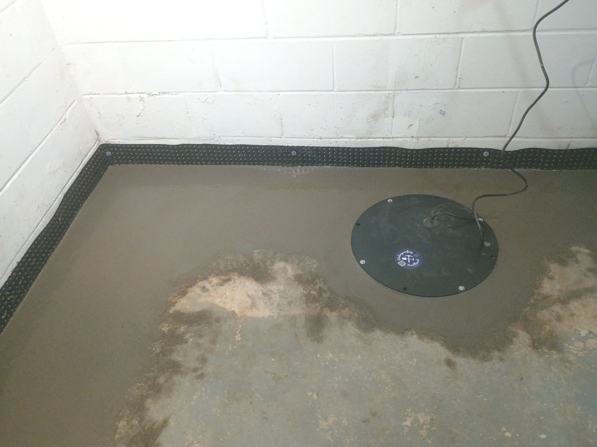 Interior Drain Tile Installation in Columbia Heights, MN by Waterproofing Northeast