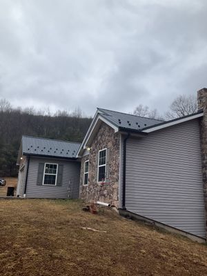 Black Metal Roof Replacement and Gutter Installation in Halifax