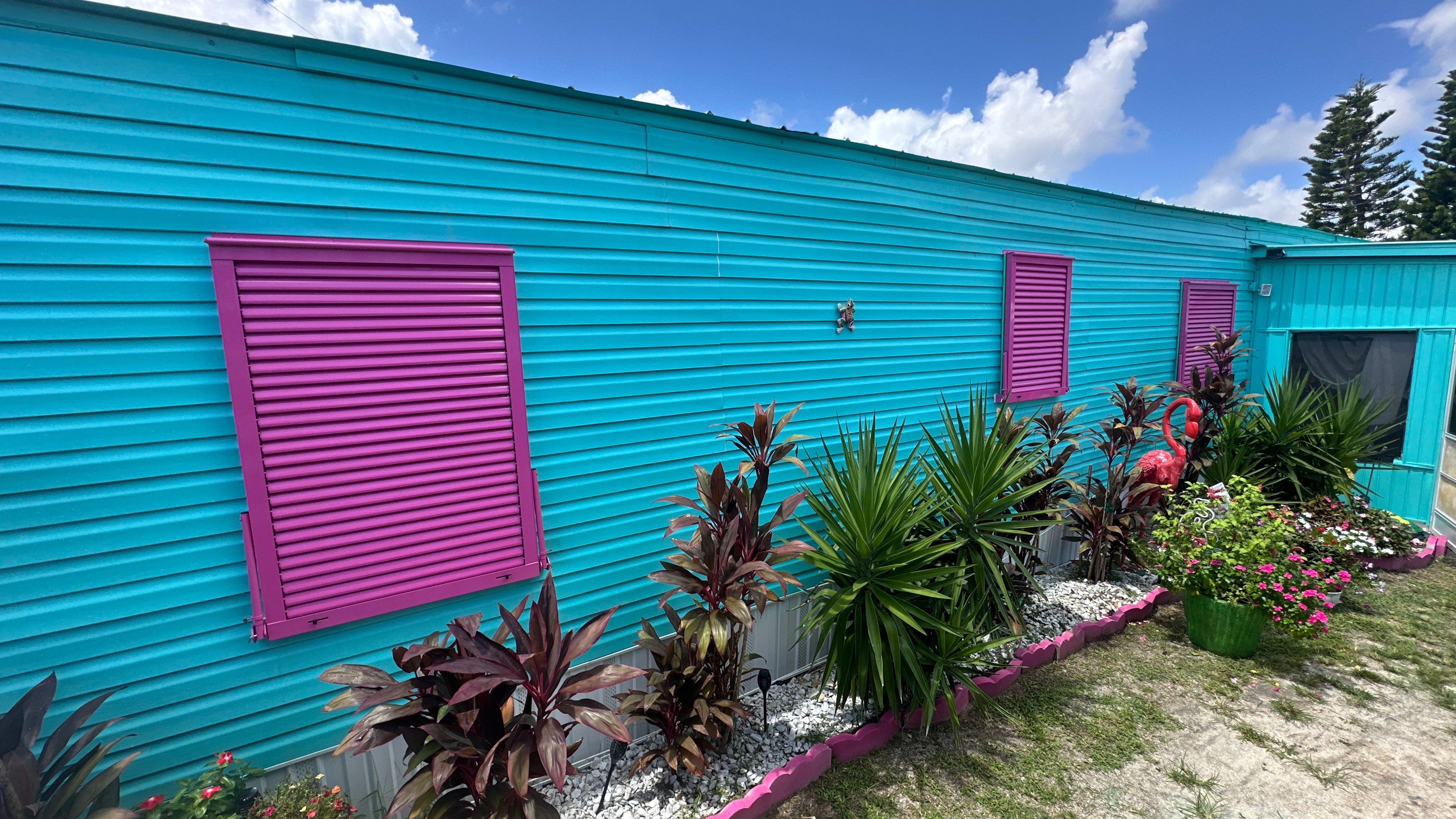Impact Bahama Shutters in Heather Violet by Smart Guard Shutters