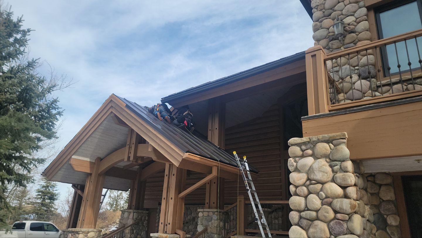 Standing Seam Metal Roof Replacement After Snow Damage by ASAP Roofing & Restoration