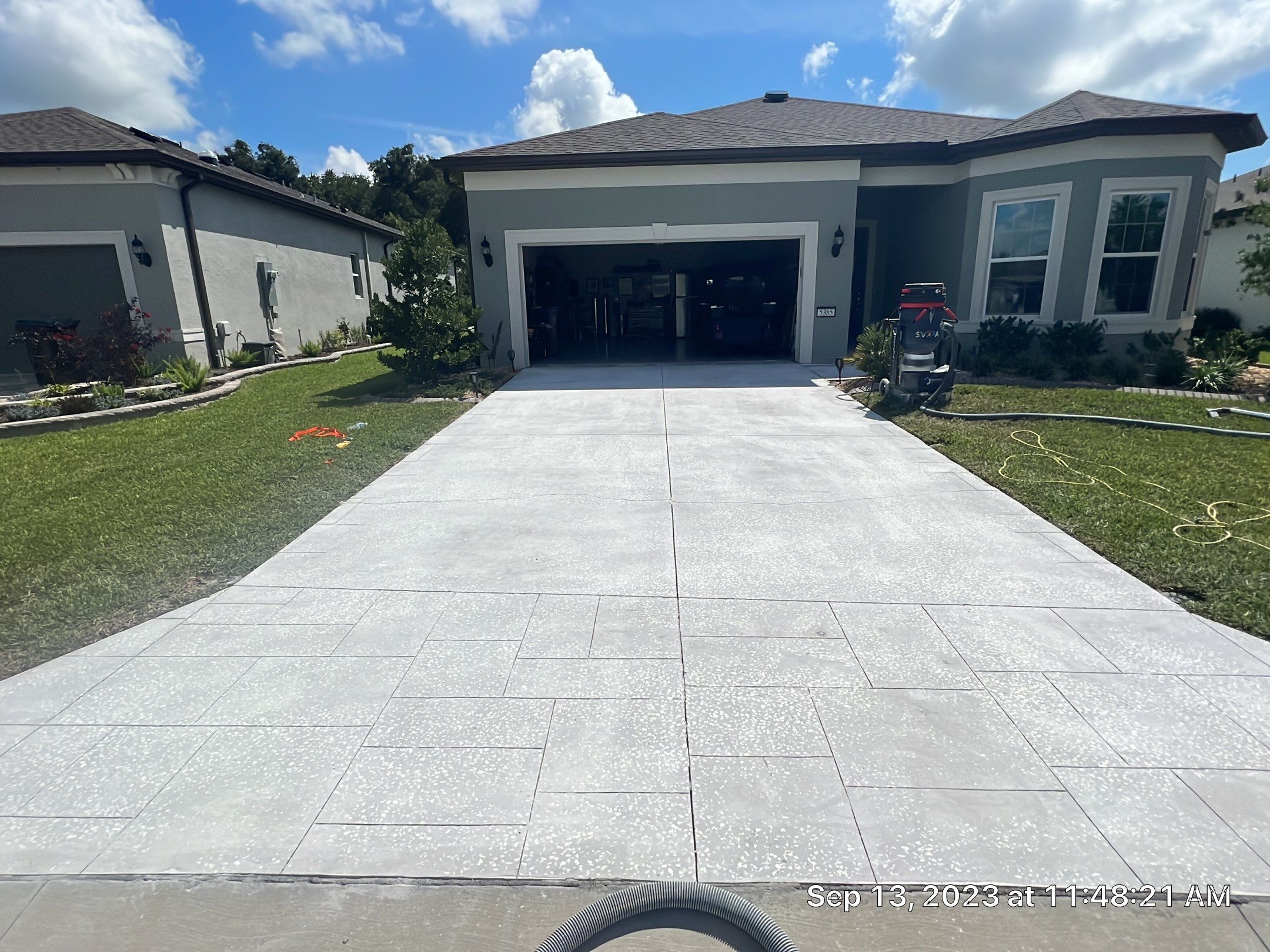 Driveway and Sidewalk in Slatestone with Silvercreek Border by Innovative Concrete Coatings 