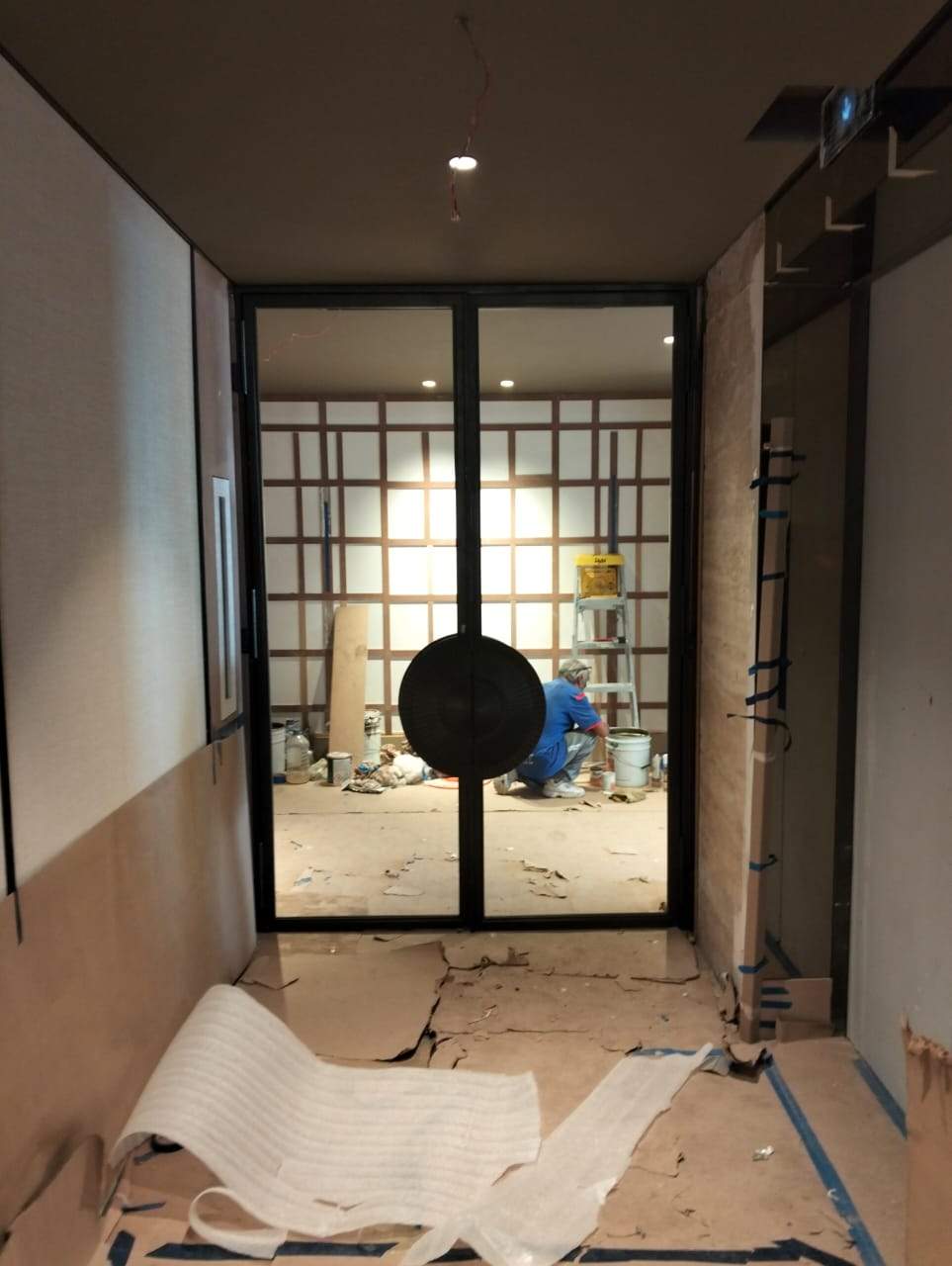 Modern Black Frame Double Door Installation with Custom Radial Hardware by Solara Custom Living