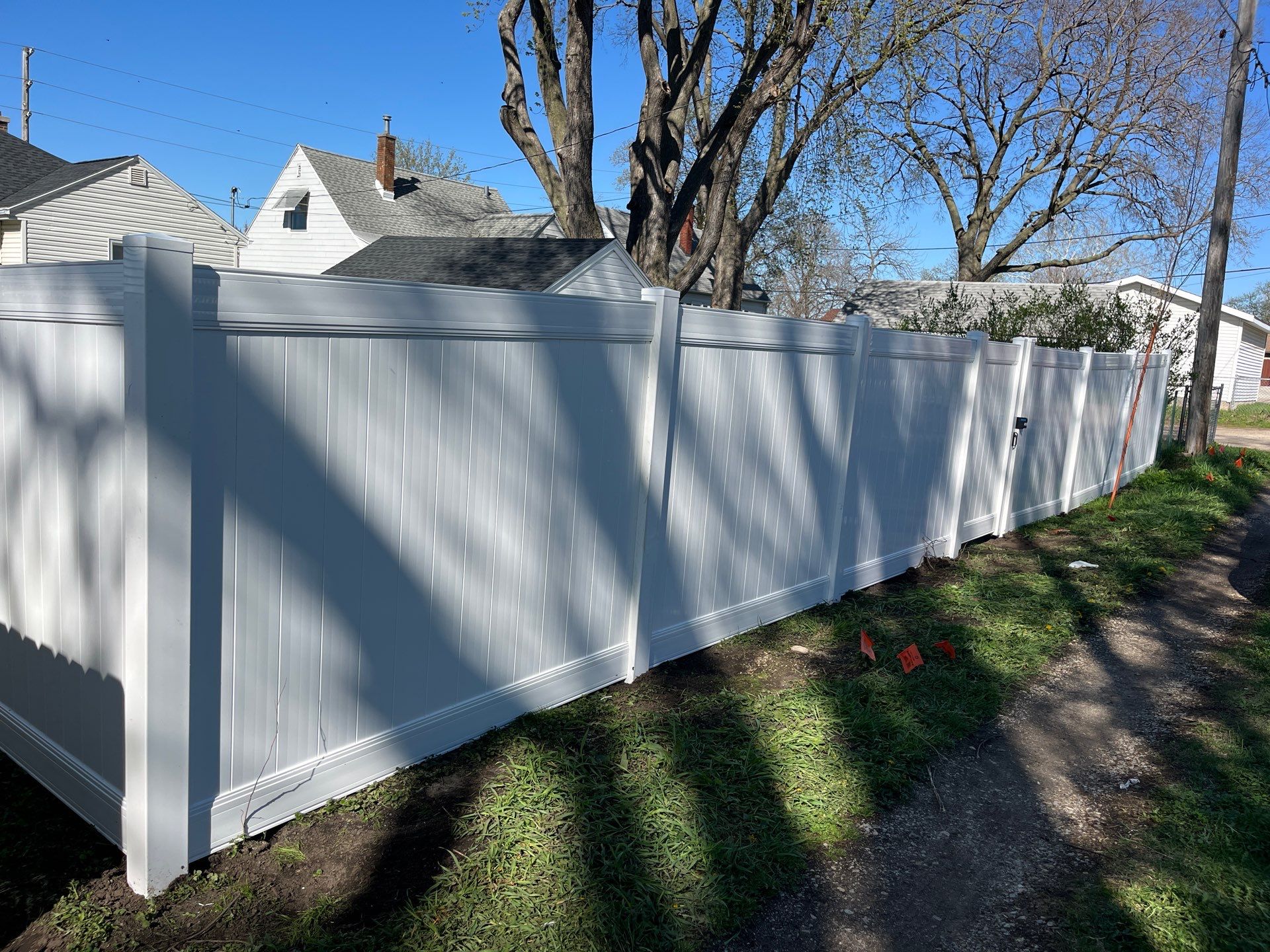 Residential White Vinyl Privacy Fence Installation in Waterloo, Iowa by Perfect Picket Fence and Stain