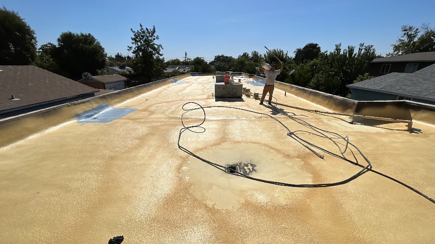 Foam Refurbish using Conklin Benchmark/PUMA XL coatings and spray foam; Also metal roofing around parapet wall by Straight Edge Roofing Inc