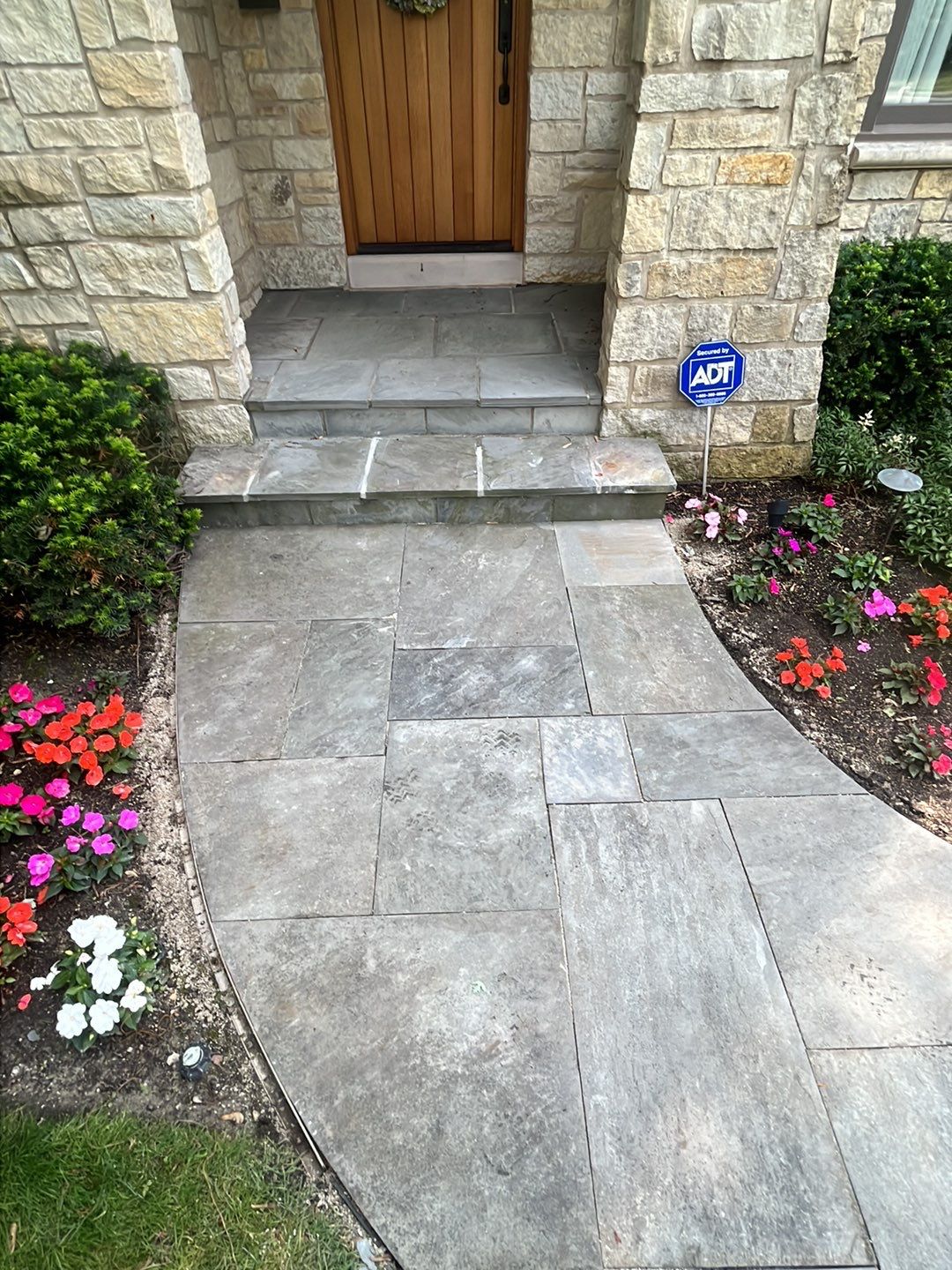 Northbrook, IL stucco home soft wash and stone cleaning by Northern Power Washing LLC.