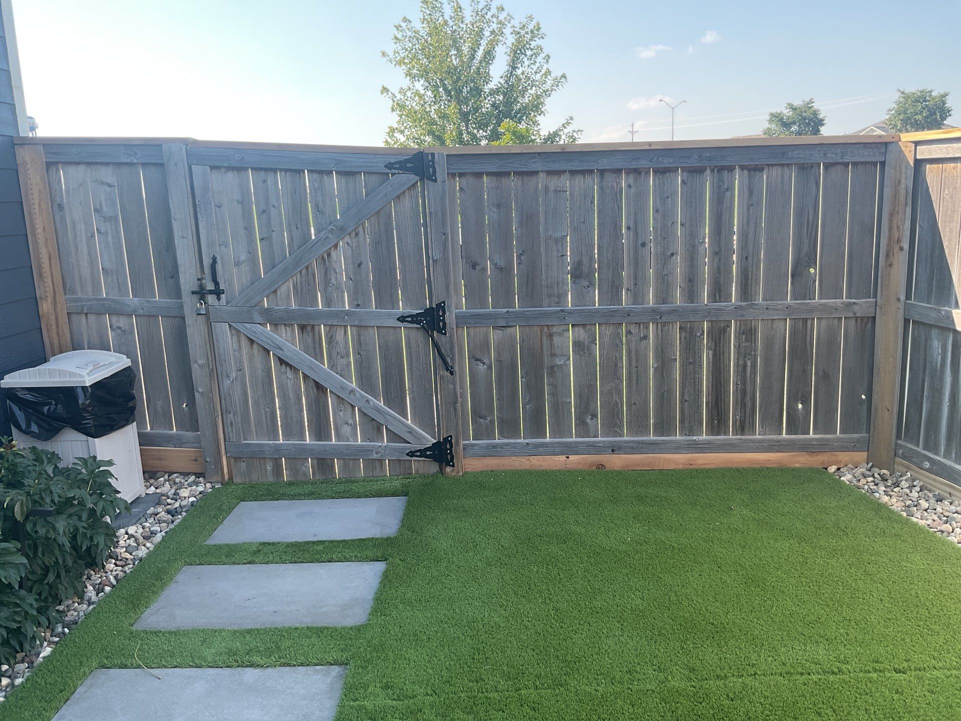 Custom Privacy Fence and Paver Patio Installation in Sioux Falls by Select Painting, Coatings & Garage Cabinets