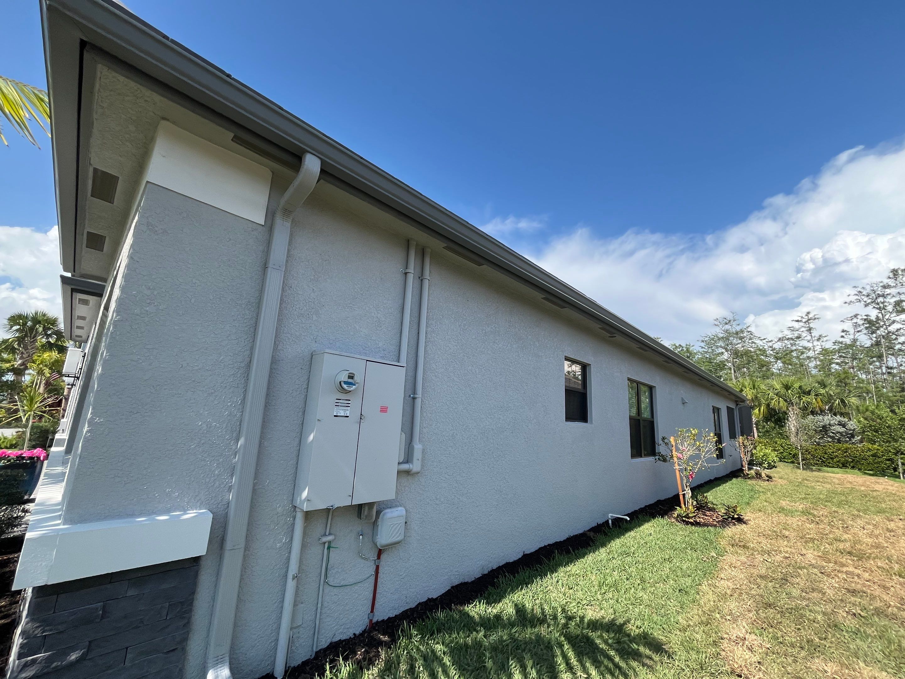 Grey Seamless Gutter Installation in Estero FL by Gutter Professors