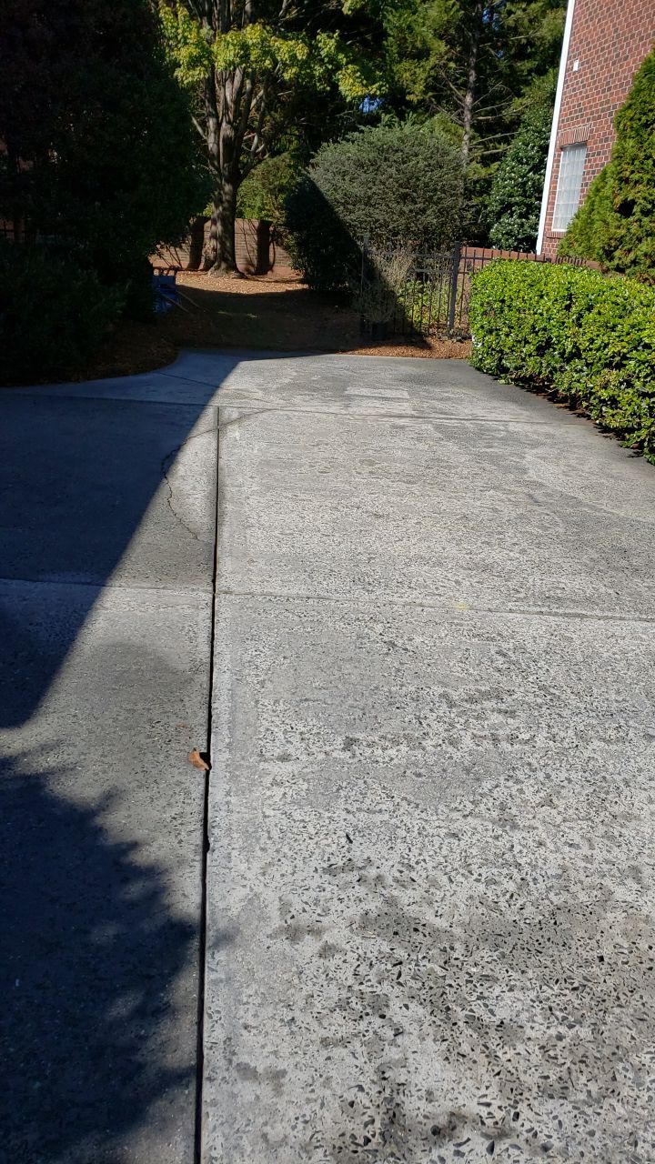 Driveway Clean using cleaner by Power Wash Masters LLC