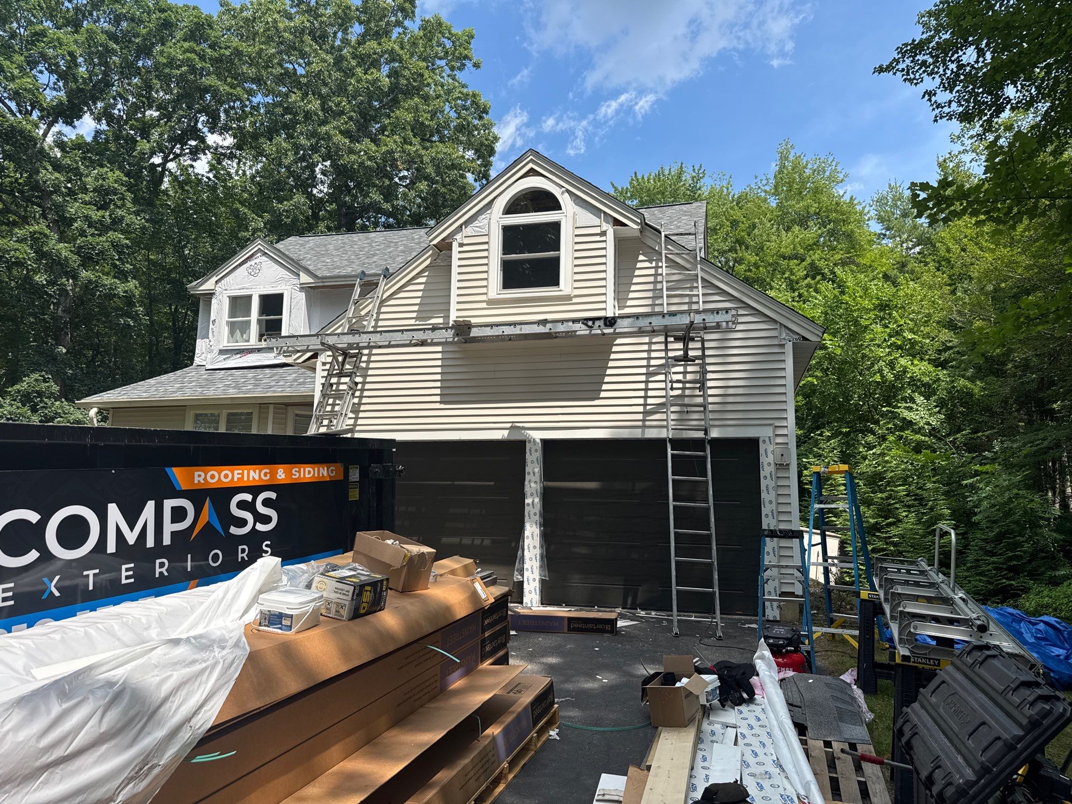 Complete Exterior Remodel in Stratham, NH Near Turnberry Road with Roofing, Siding, Windows, Gutters, and PVC Trim by Compass exteriors