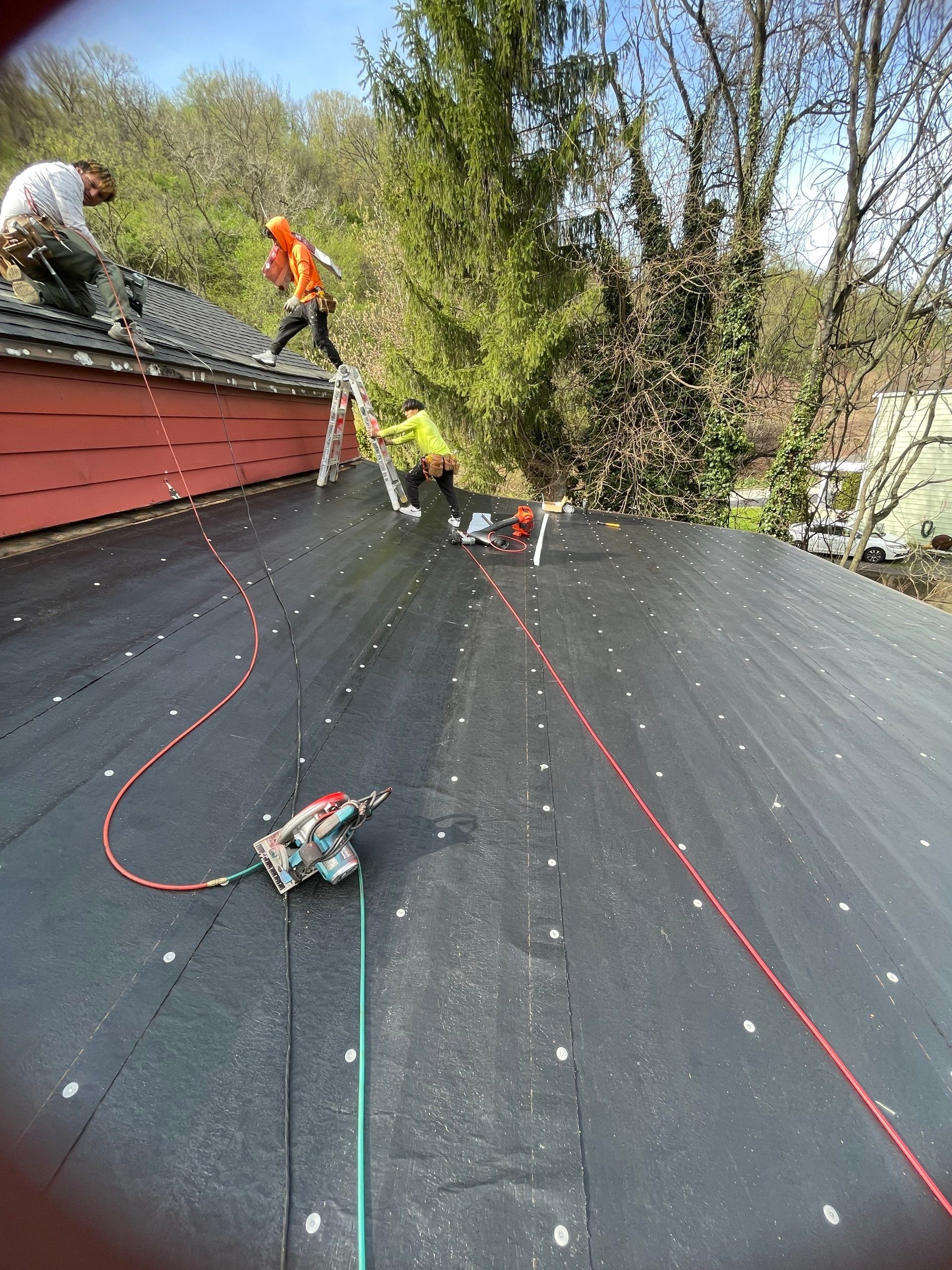 Roof sunspace deck  by Cousins Roofing Siding & Decks