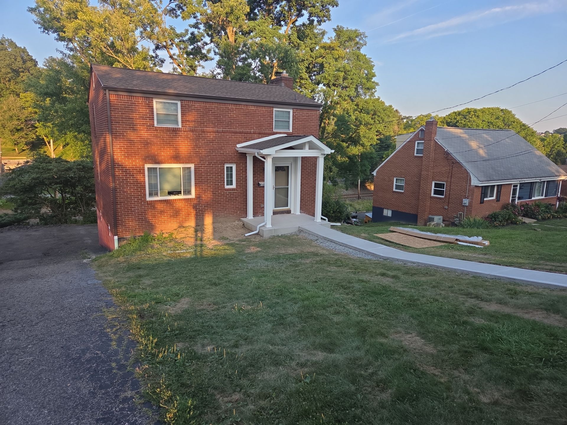 Concret and roof build  by Cousins Roofing Siding & Decks