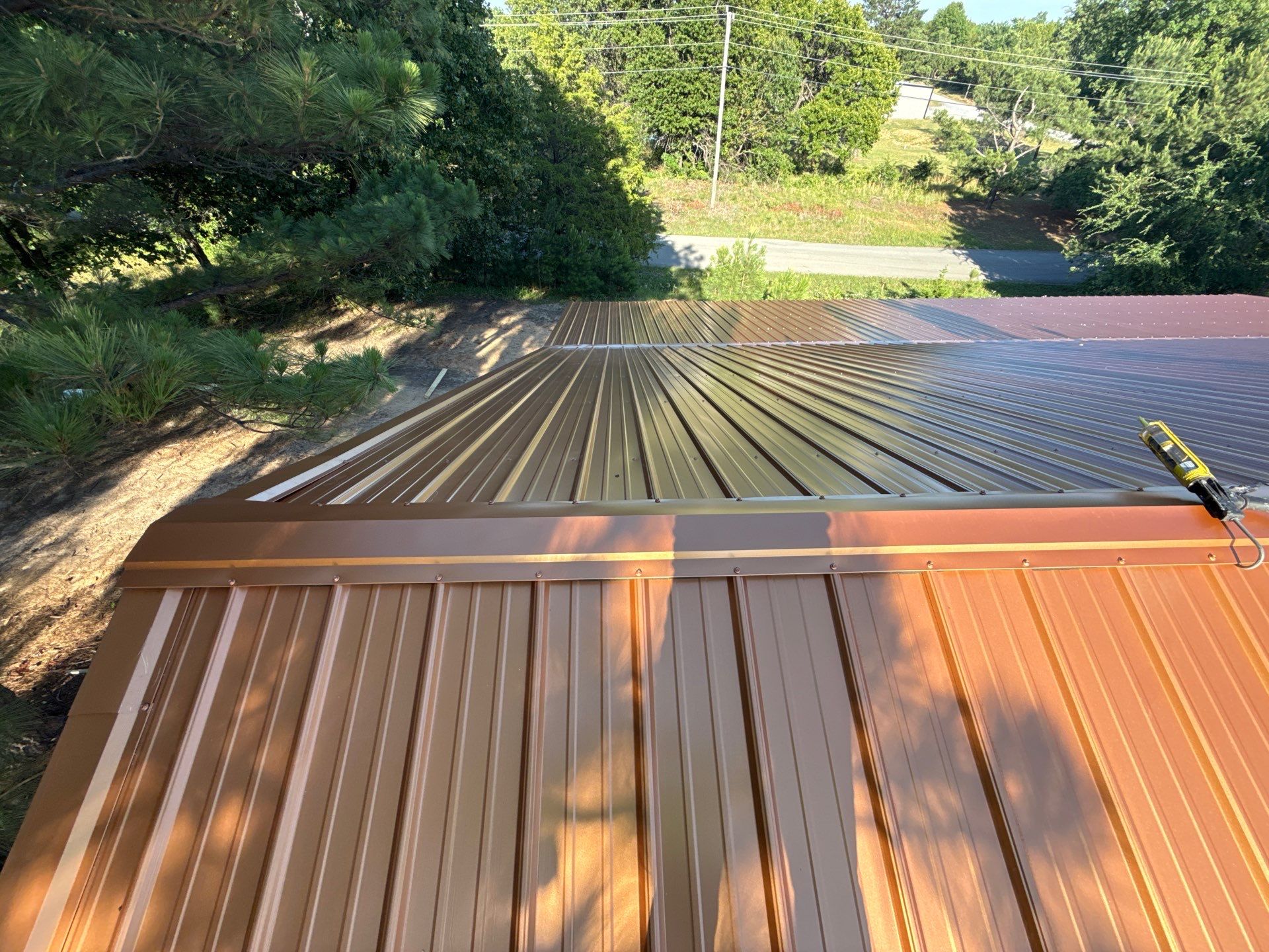 Copper Metallic 26-gauge low rib metal roofing. by In & Out Construction & Remodeling, LLC