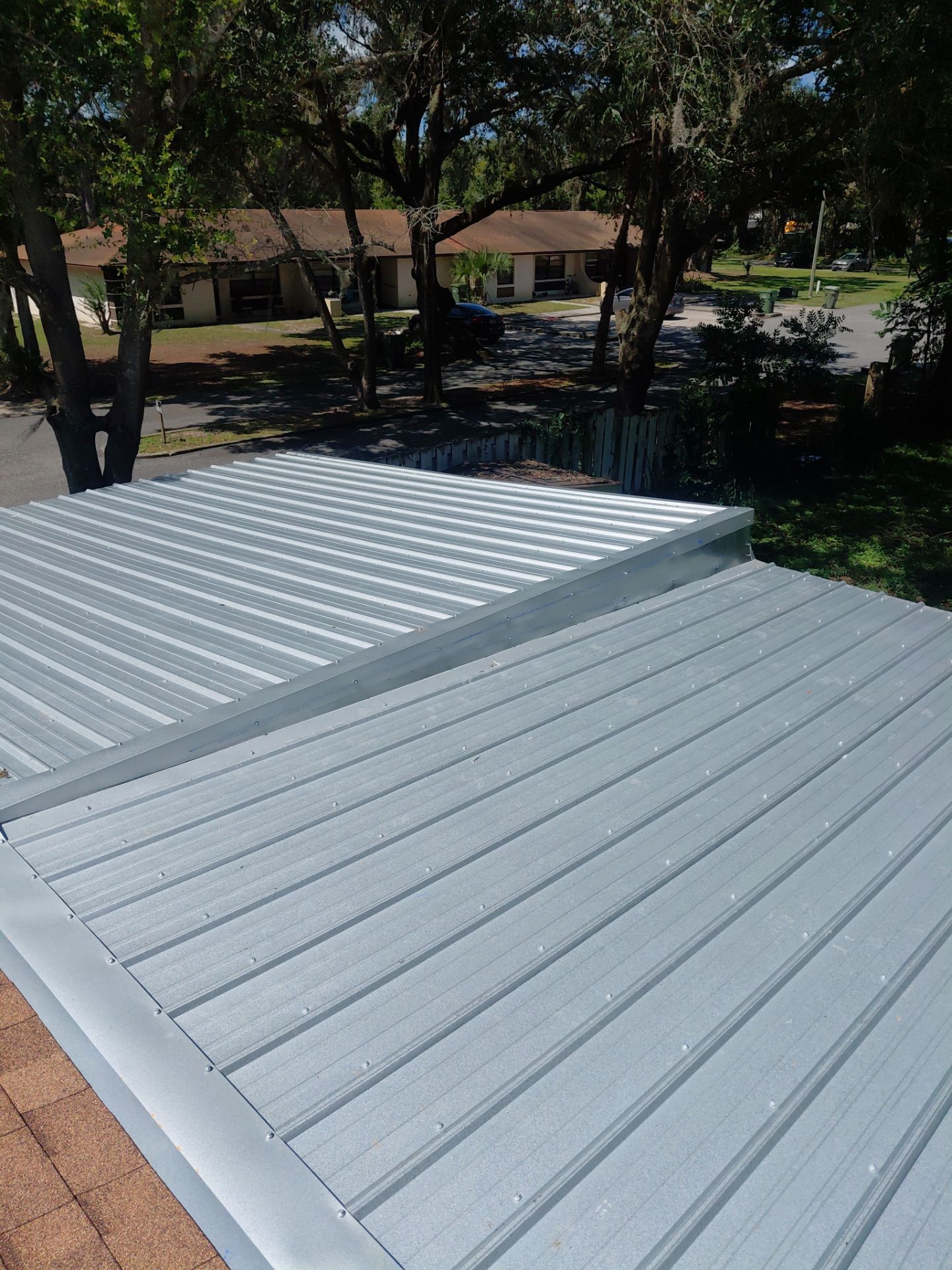Combined Shingle and Metal Residential Roof Replacement in Leesburg Florida by Pinnacle Roofing Group
