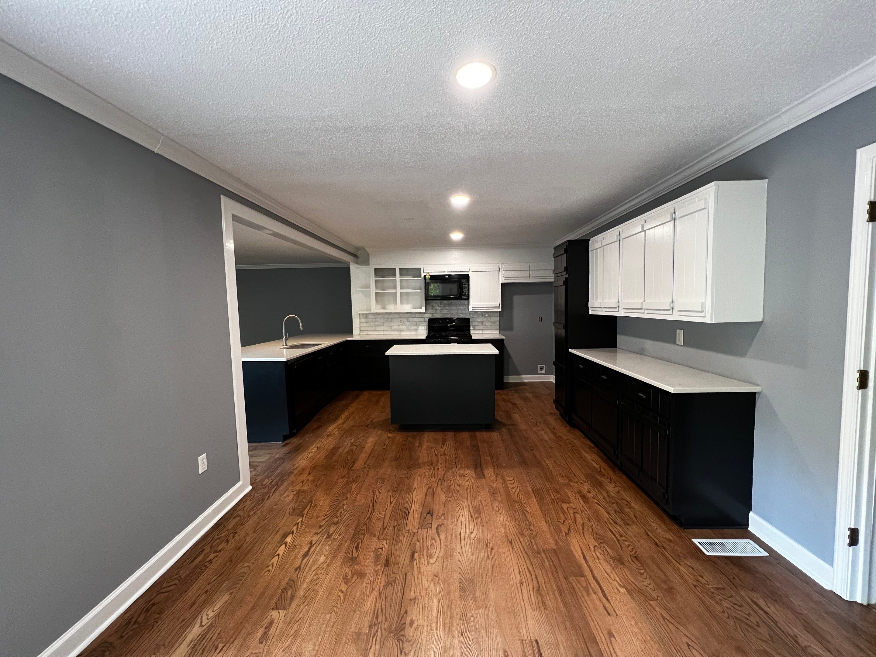 Kitchen and Living Area Renovation Featuring Hardwood Flooring in Smyrna by Swift Home Renovations