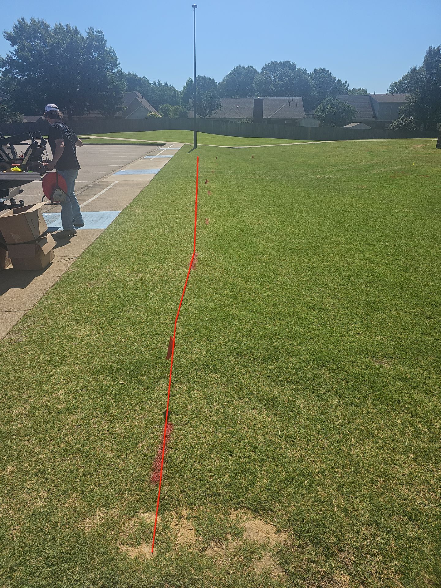 Utility Locating at a school for fence install by Alsip Locating Service, LLC