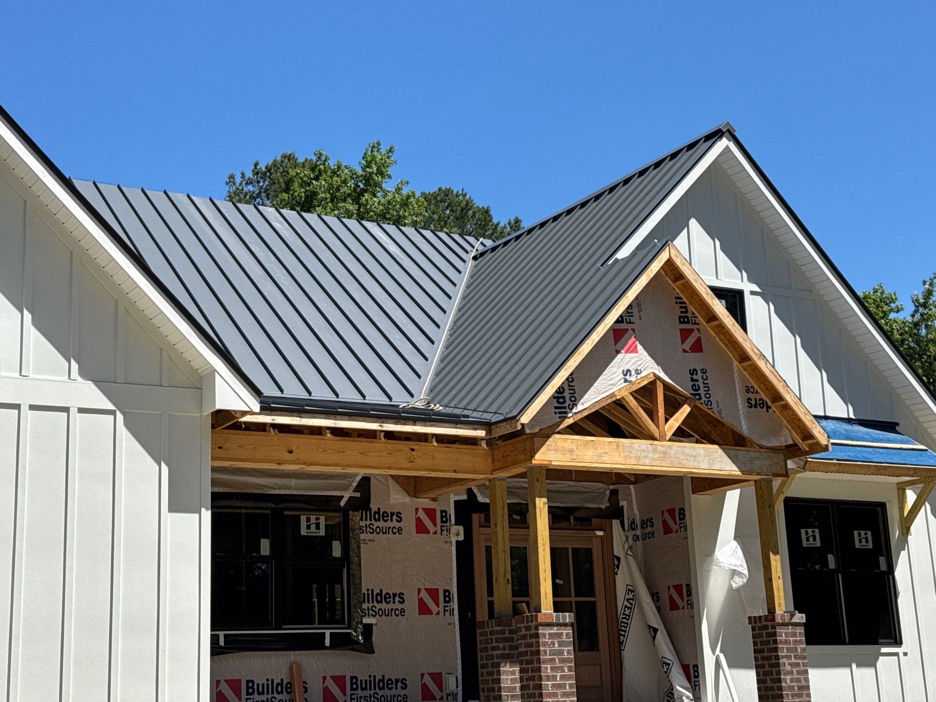 Custom New Construction Home Featuring Standing Seam Metal Roofing in Port Haywood by Cade Construction
