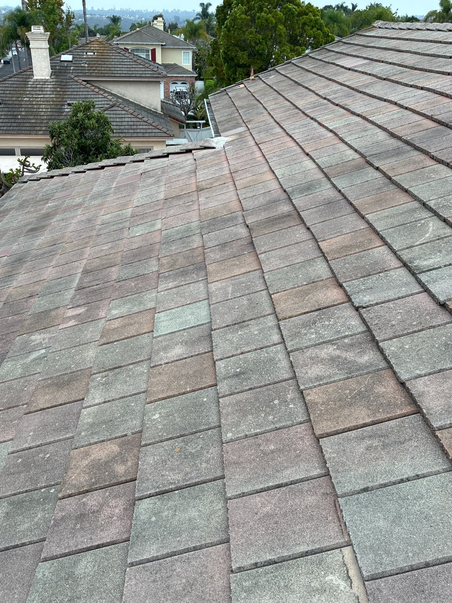 Carlsbad Concrete Tile Roof Replacement with Copper Flashing and Skylights by Reliable Roofing San Diego Inc.