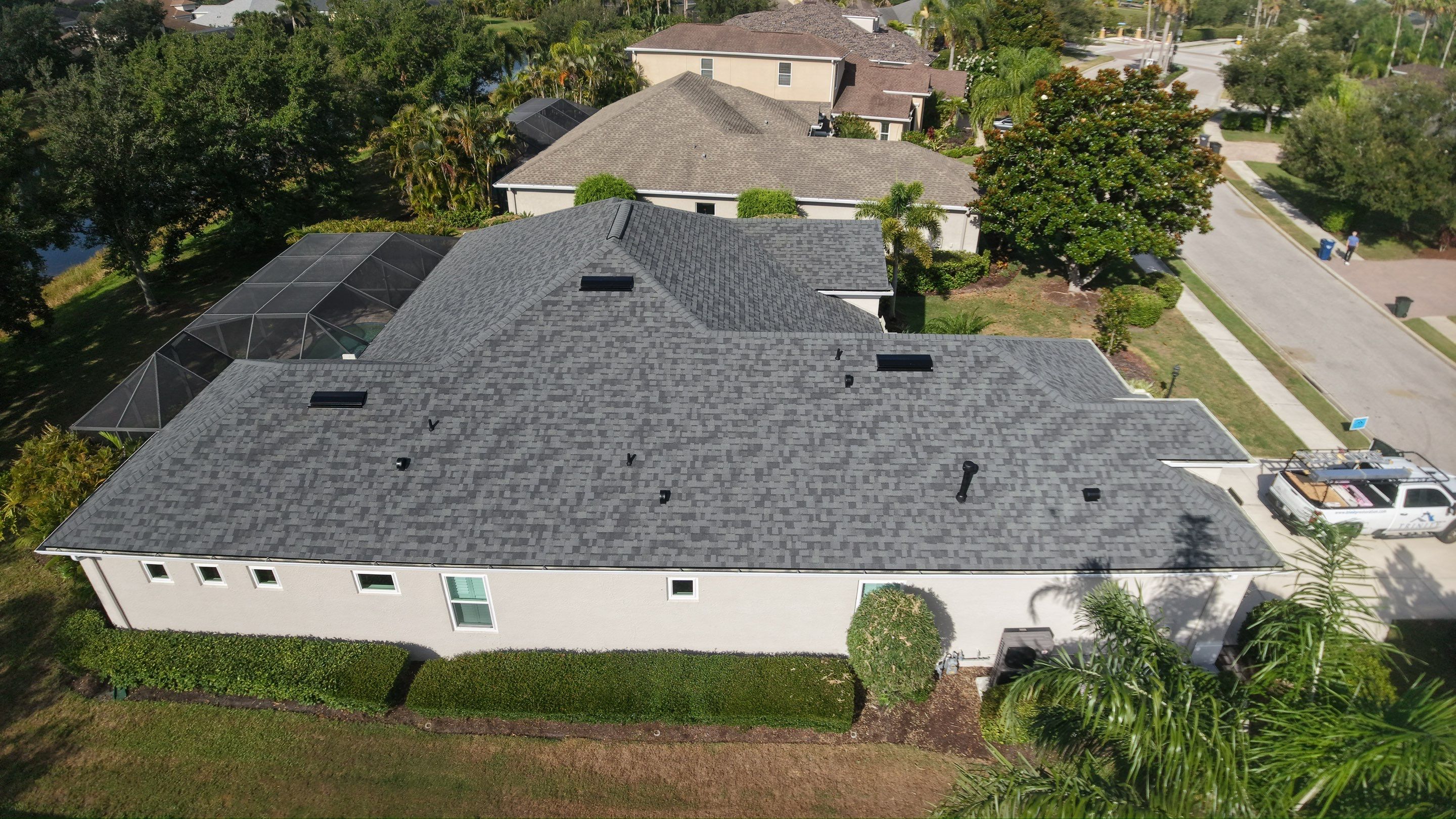 Residential Roof Installation With Estate Grey Architectural Shingles in Bradenton by Trinity Restoration and Roofing LLC
