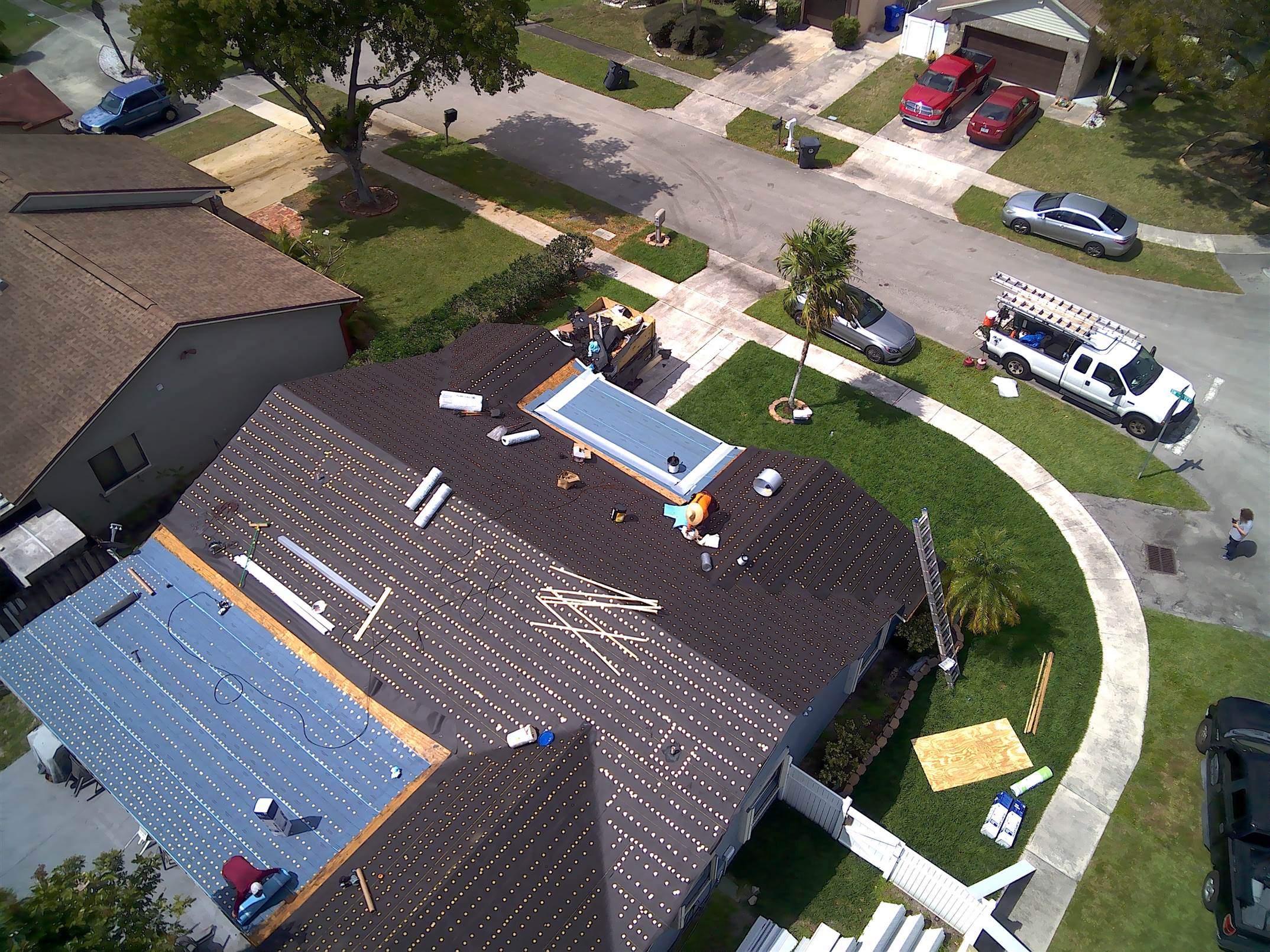 Standing Seam Metal & Flat Re-Roof using 1.5" Nail Strip 24ga Solar White Kynar Coated Standing Seam Metal Panels by Morton Roofing, Inc.