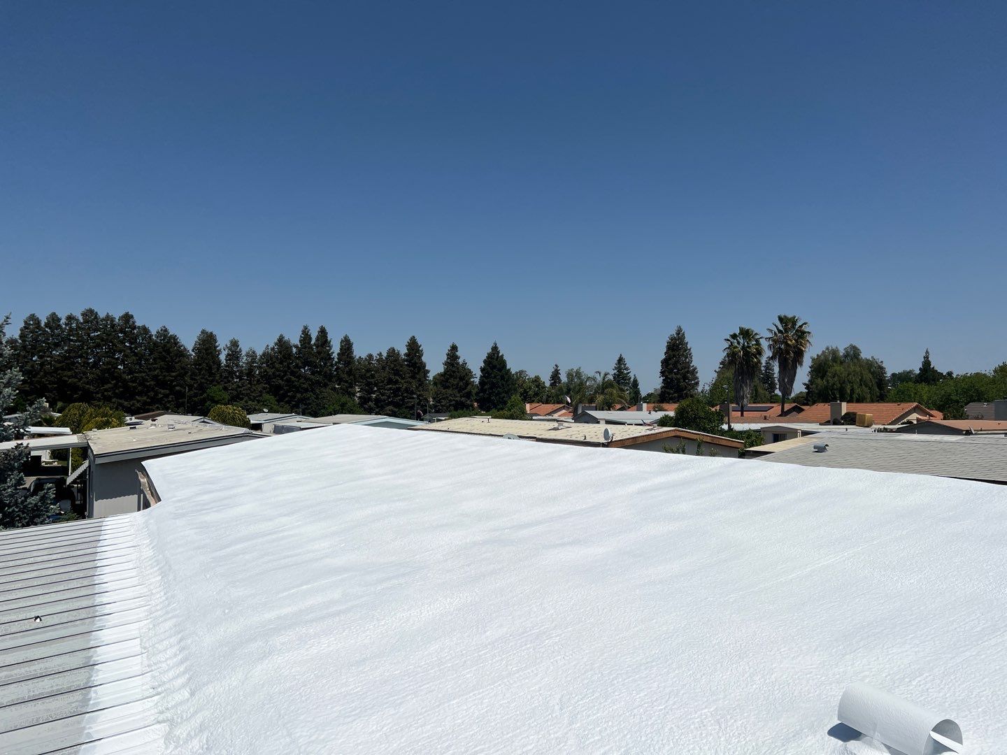 Spray foam and coatings using General Coatings acrylic coatings and spray foam by Straight Edge Roofing Inc