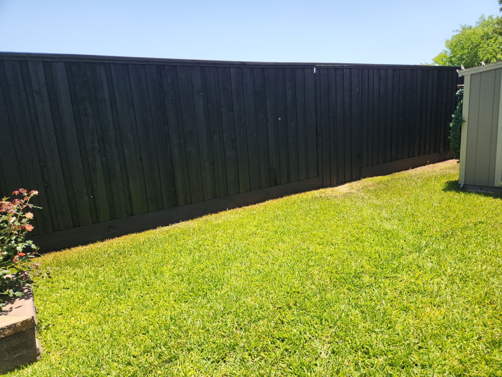 Modern Black Fence Finish by Tim's Fences