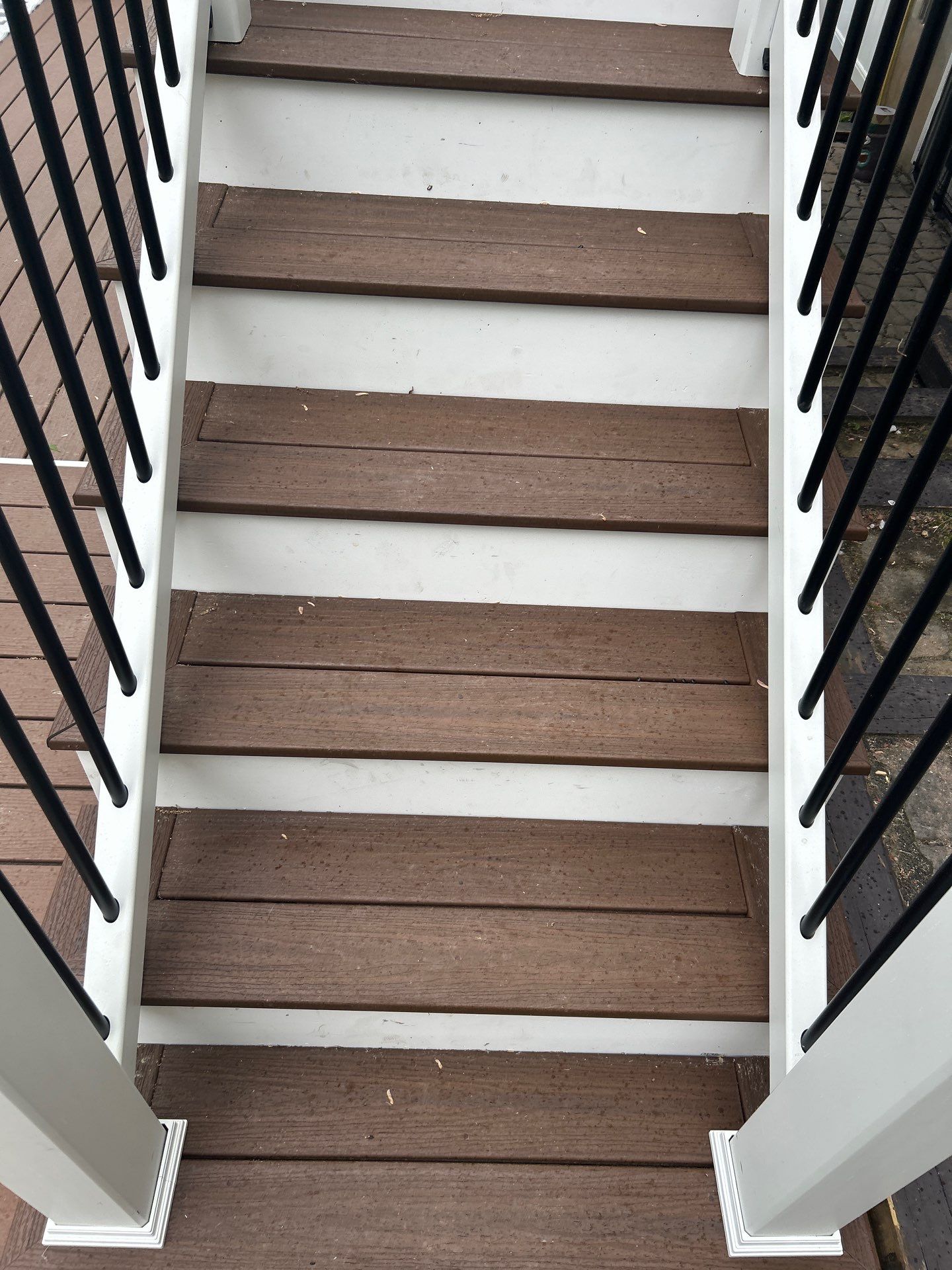 Elevated Composite Deck Replacement with White Railing in Tannersville by Herts Roofing & Construction