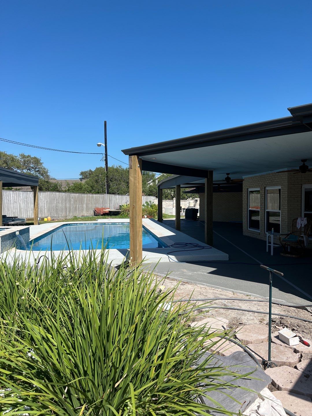 Beautiful pool side build by Bayfront Roofing and Construction