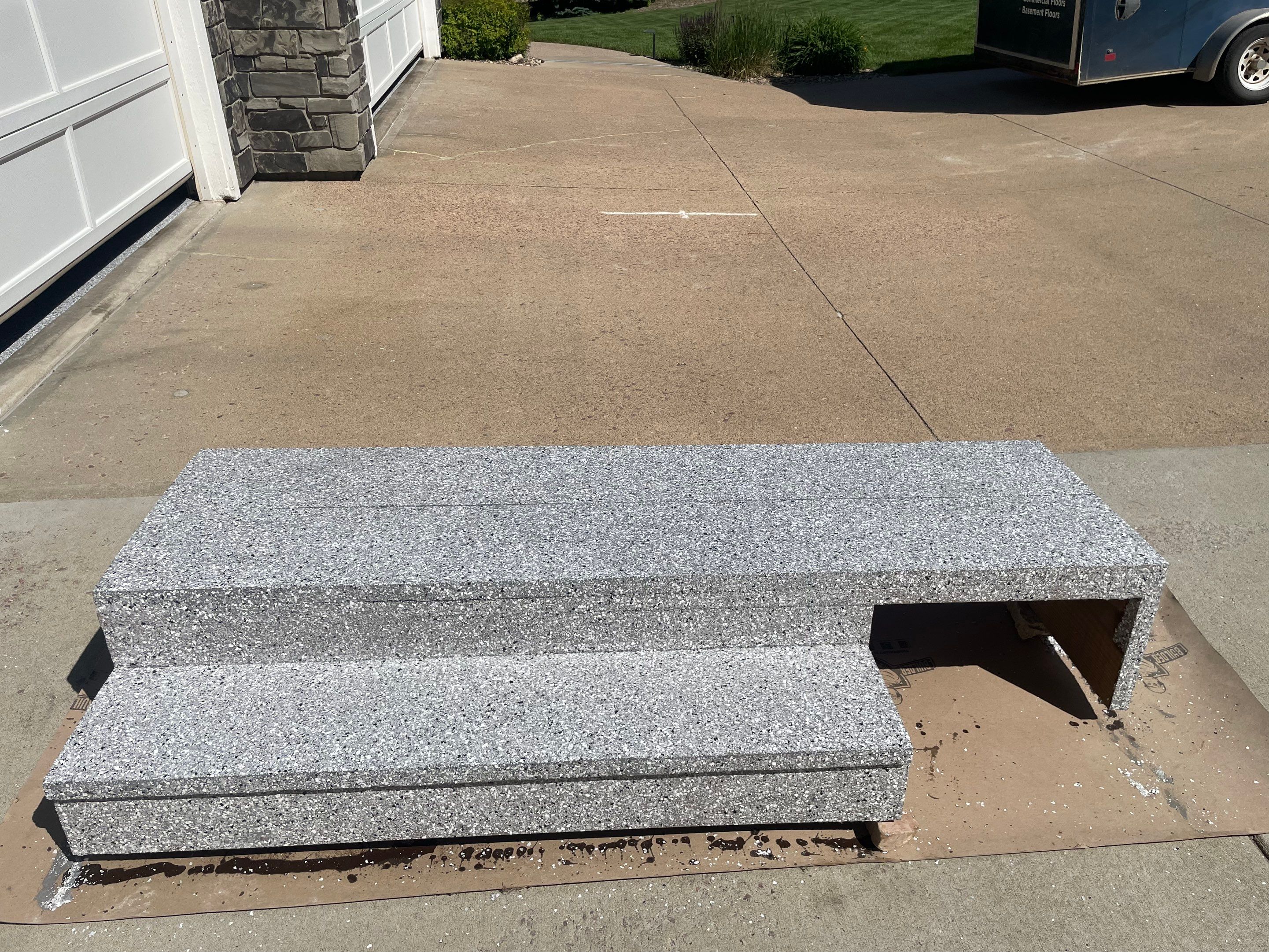 Feather Grey Garage Floor Coating Installation in Sioux Falls by Select Painting, Coatings & Garage Cabinets