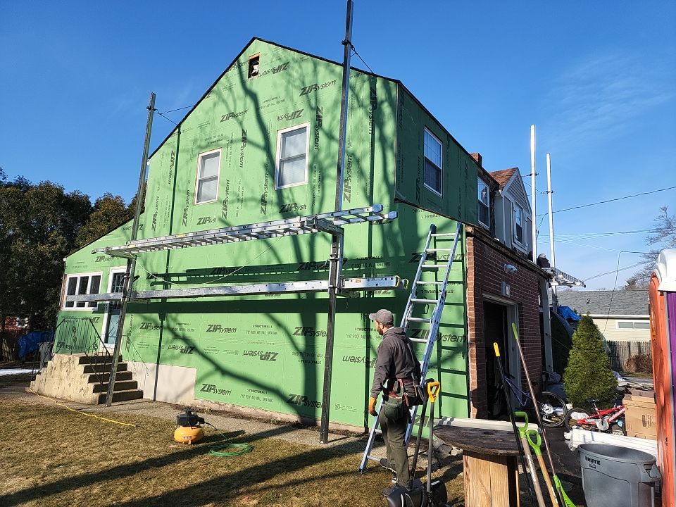 James Hardie siding, new metal roof and couple windows being installed. by UBrothers Construction